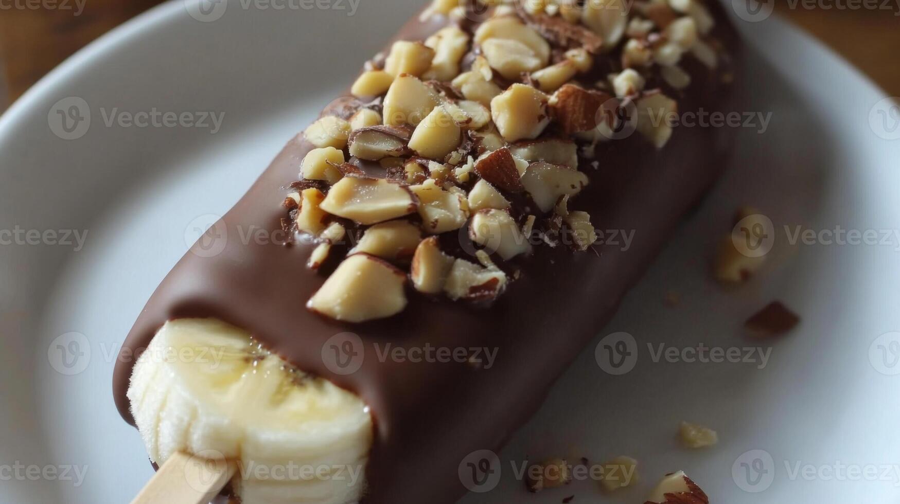 Chocolate-Covered Frozen Banana with Almonds and Hazelnuts photo