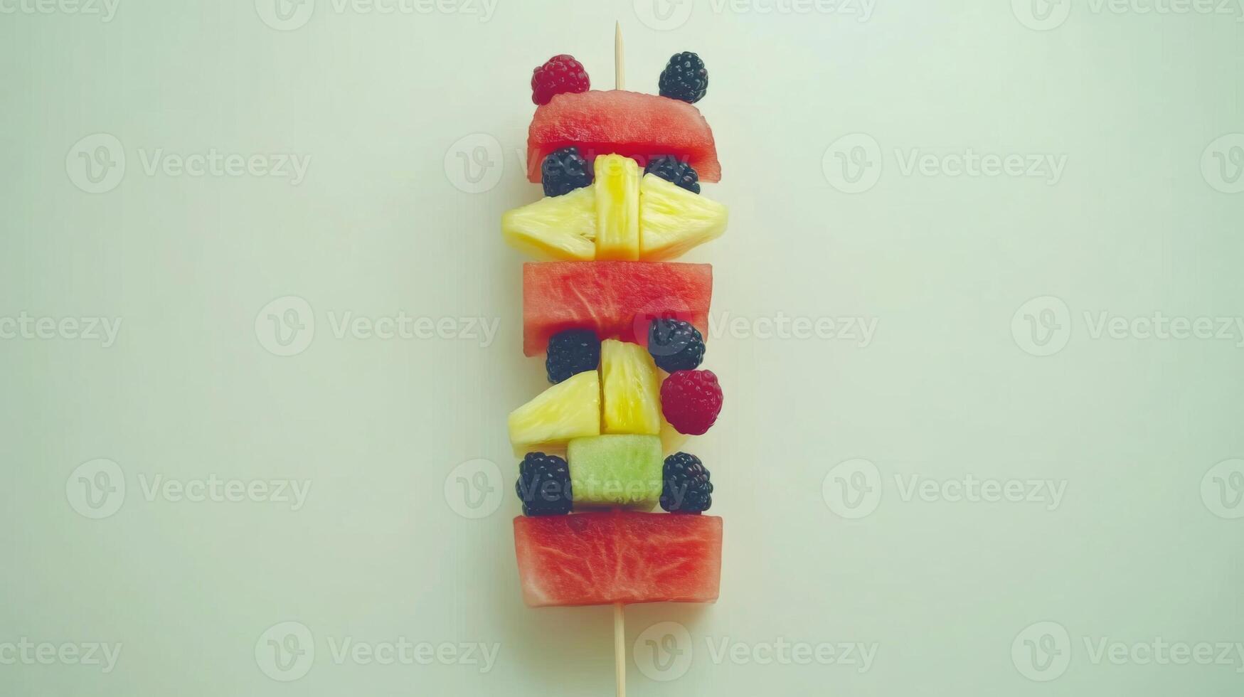 Colorful Fruit Skewer on White Background photo