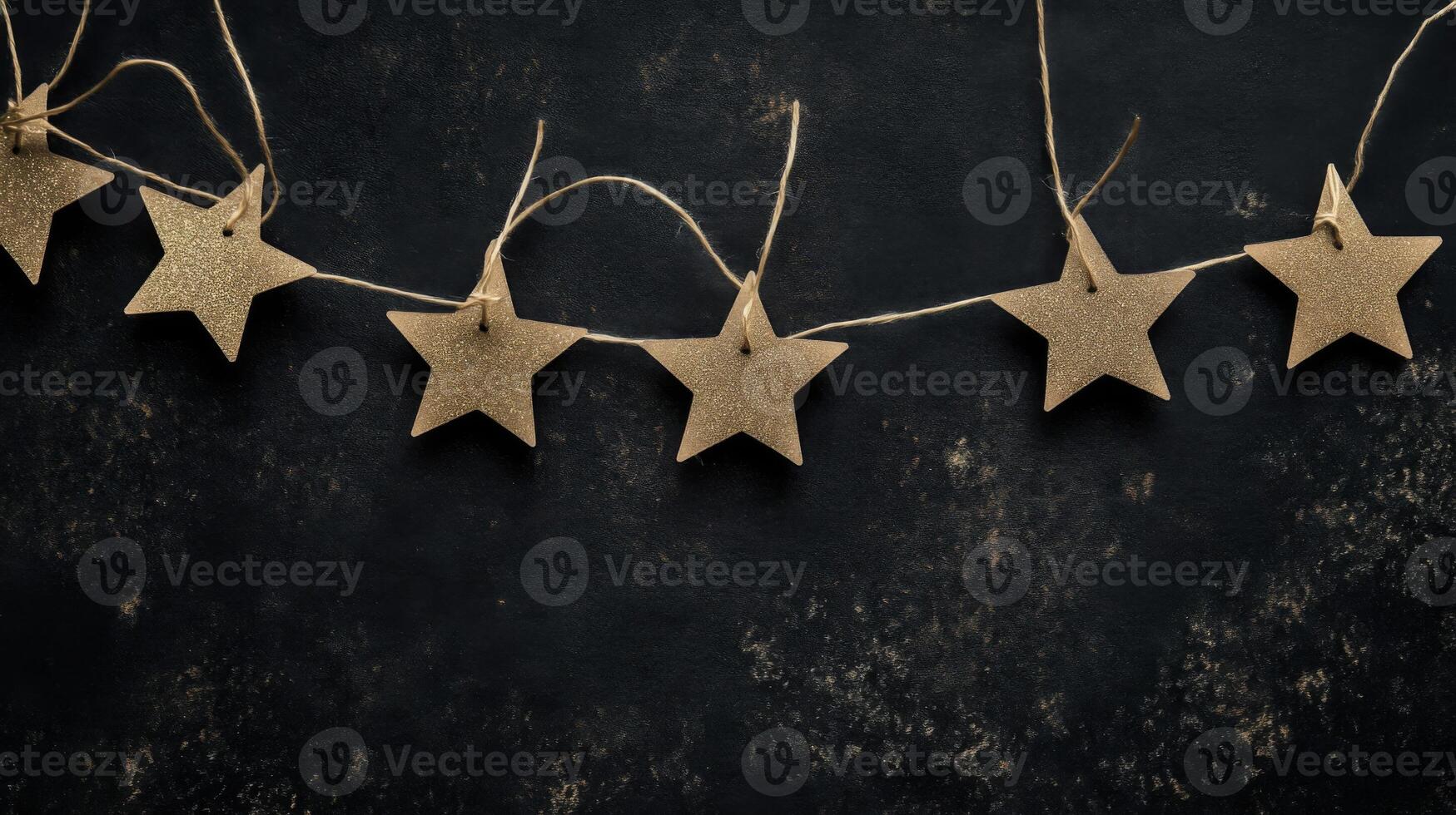 Gold Glitter Stars on Dark Background Festive Holiday Decoration photo