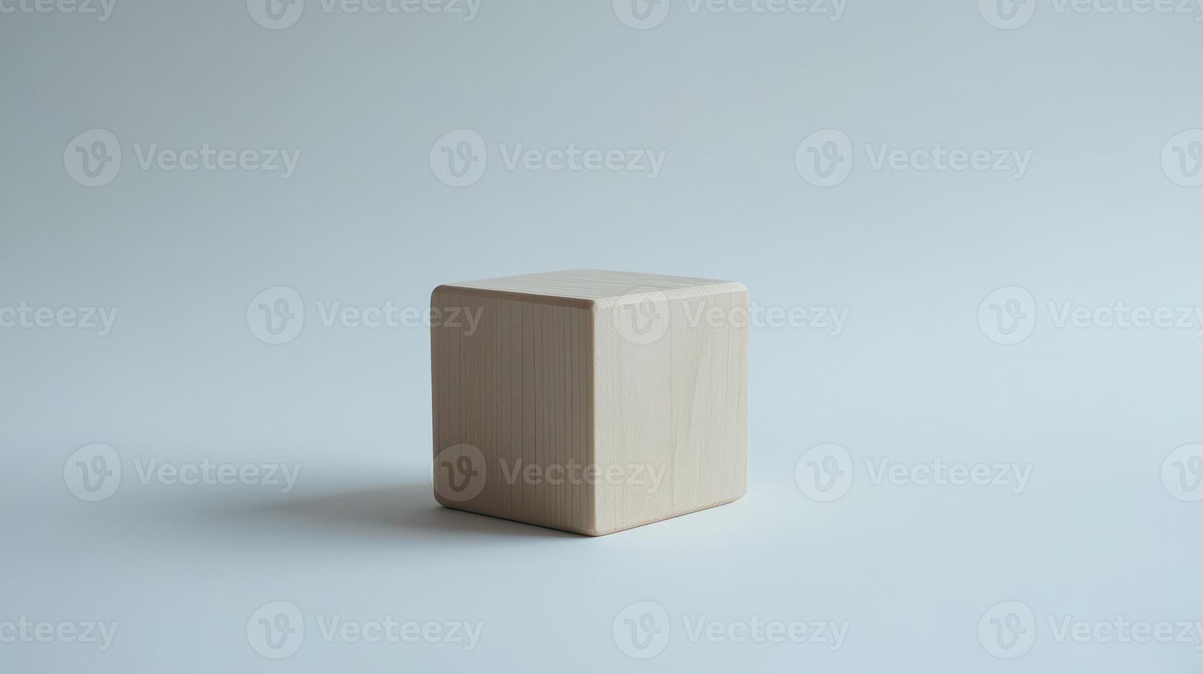 Simple wooden cube on a light background photo