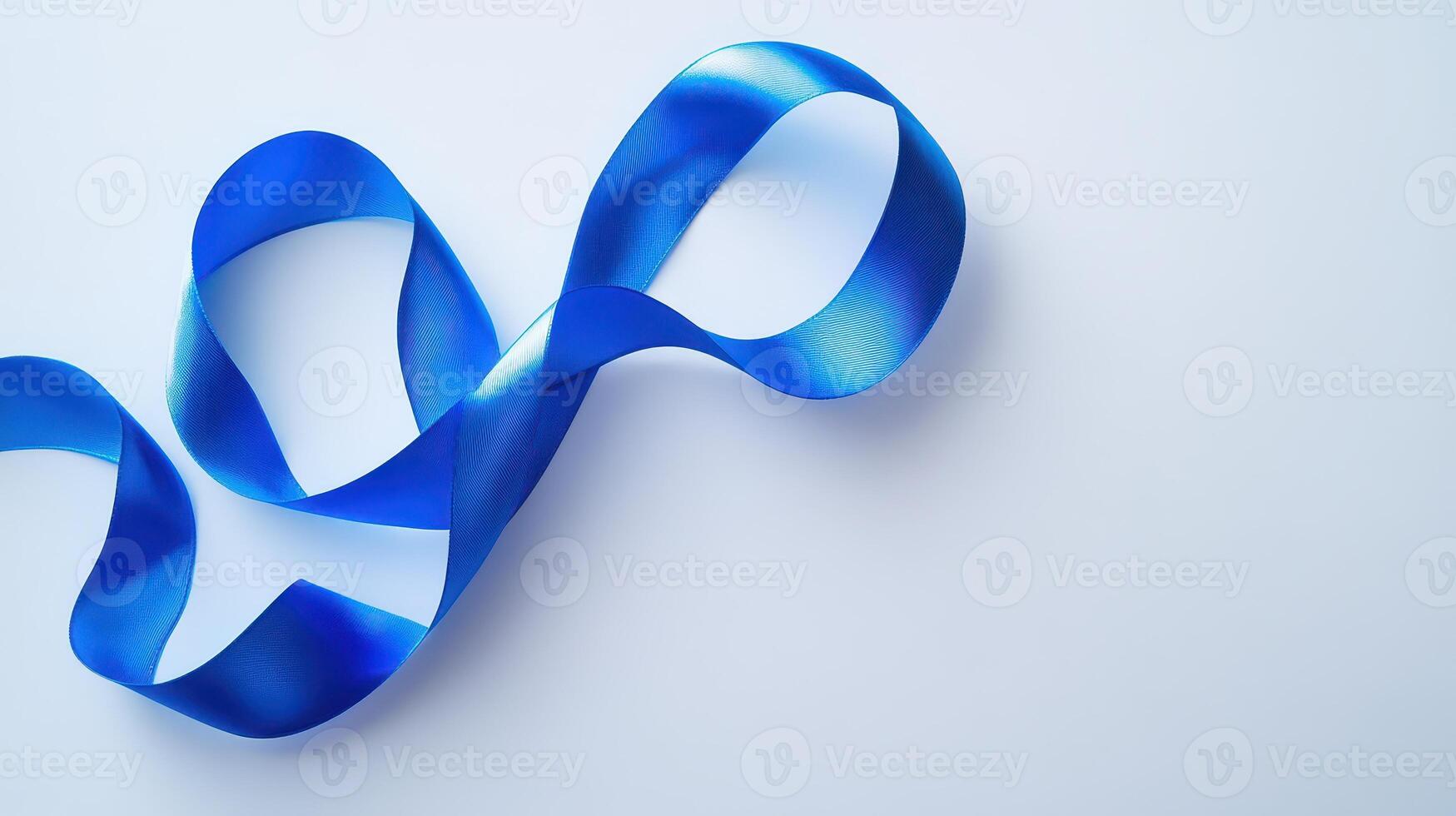 Blue ribbon elegantly twisted on white background photo