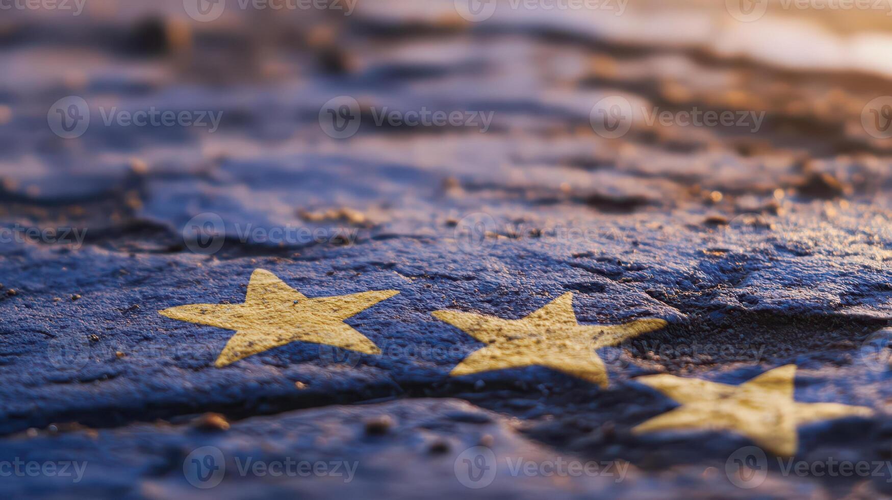 European flag stars on weathered surface at sunset photo