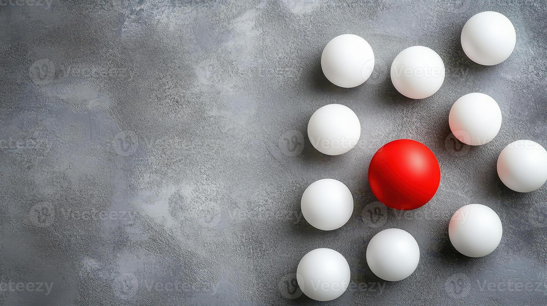 Red ball among white ones on gray photo