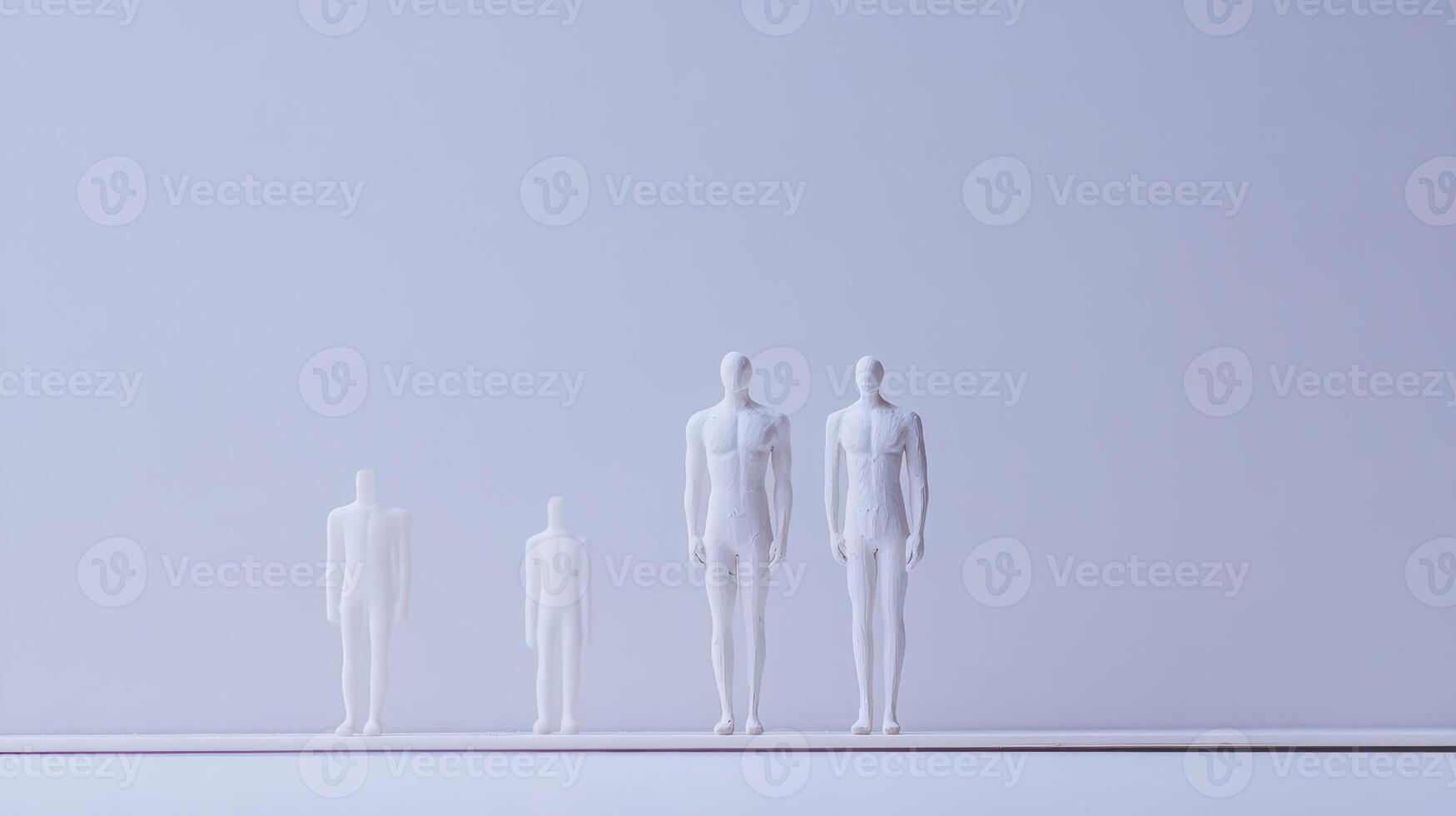 Distinct mannequins on a simple backdrop photo
