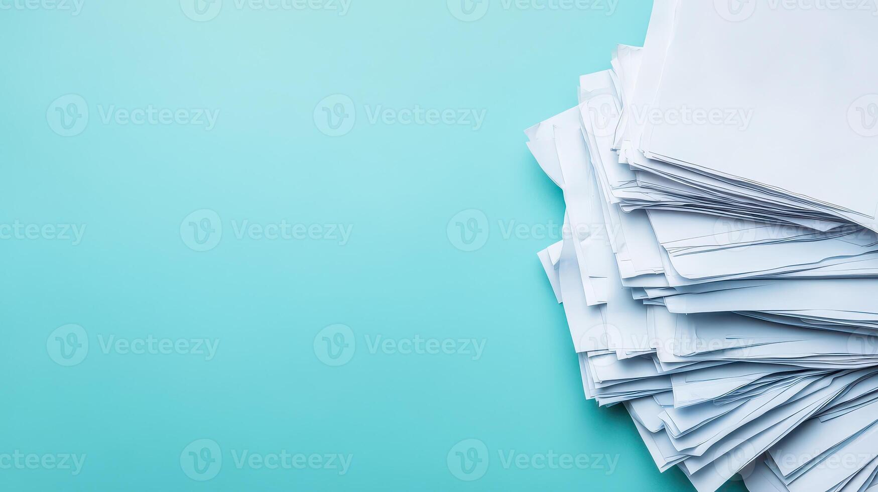Stacked blank papers on turquoise background photo