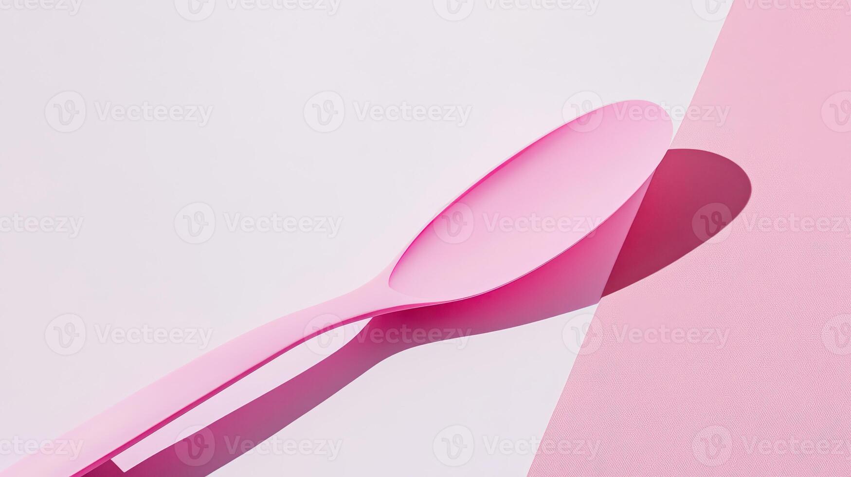 Pink spoon resting on light background photo