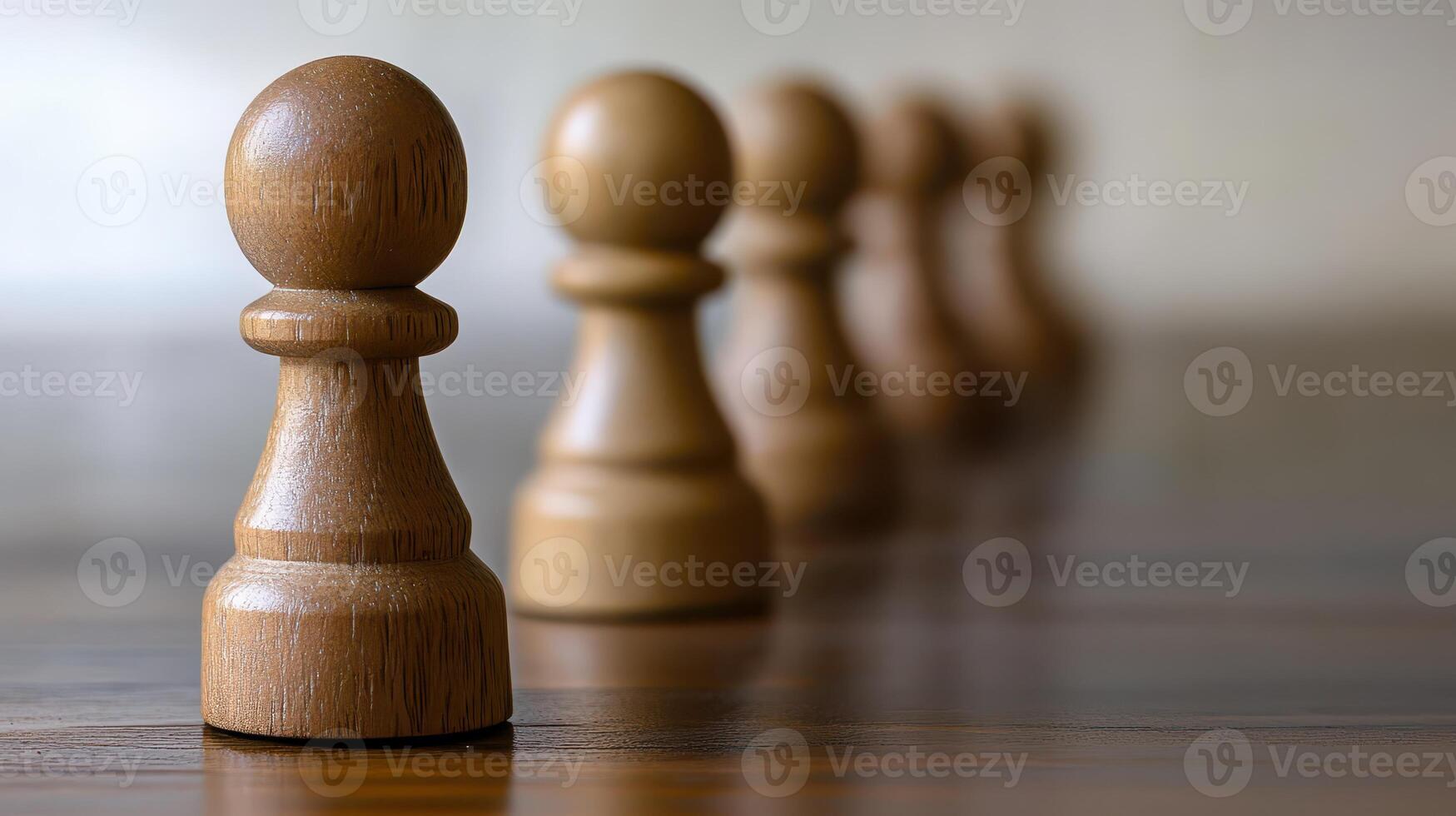 Wooden game pieces arranged in a row on a table photo