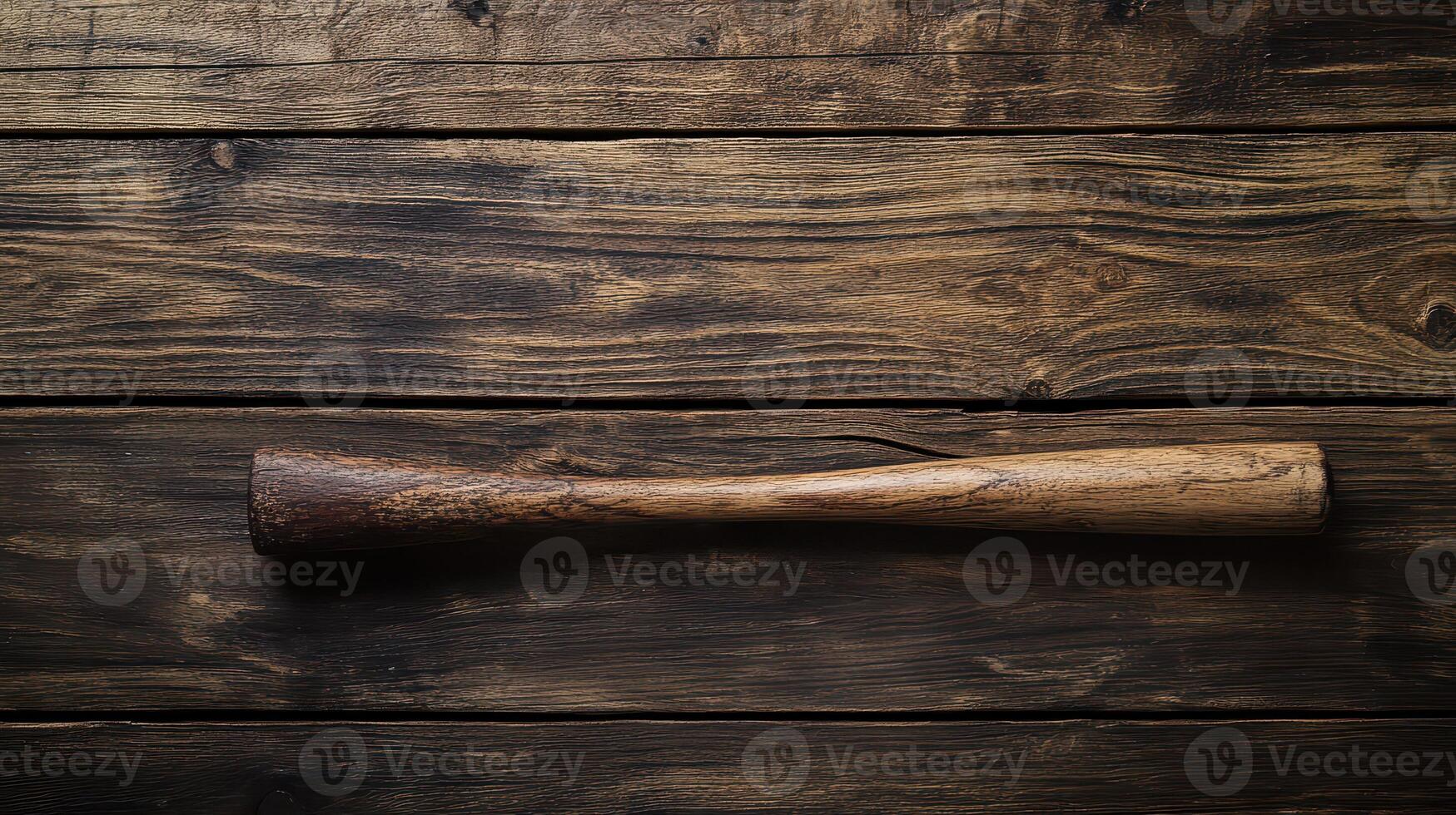 Wooden baseball bat on rustic wooden surface photo