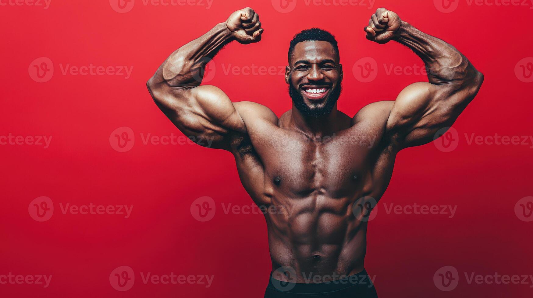 Strong man flexing muscles against a red backdrop photo