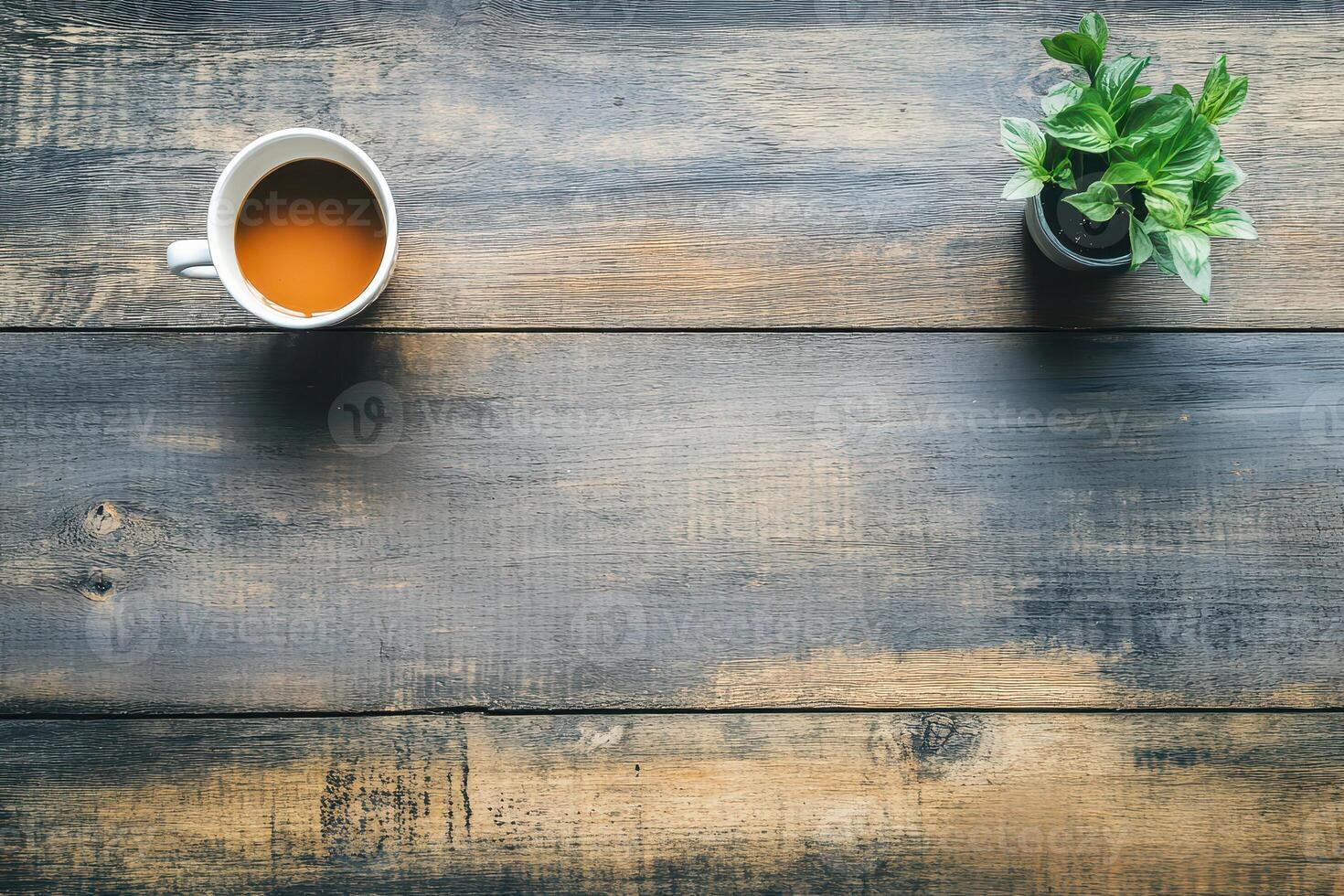 Tea and greenery on a rustic wooden table photo