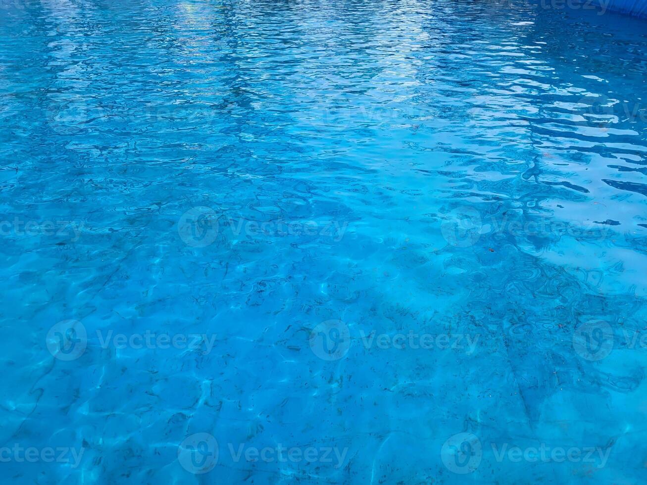 In the blue pool, the wind raised ripples on the surface of the water photo