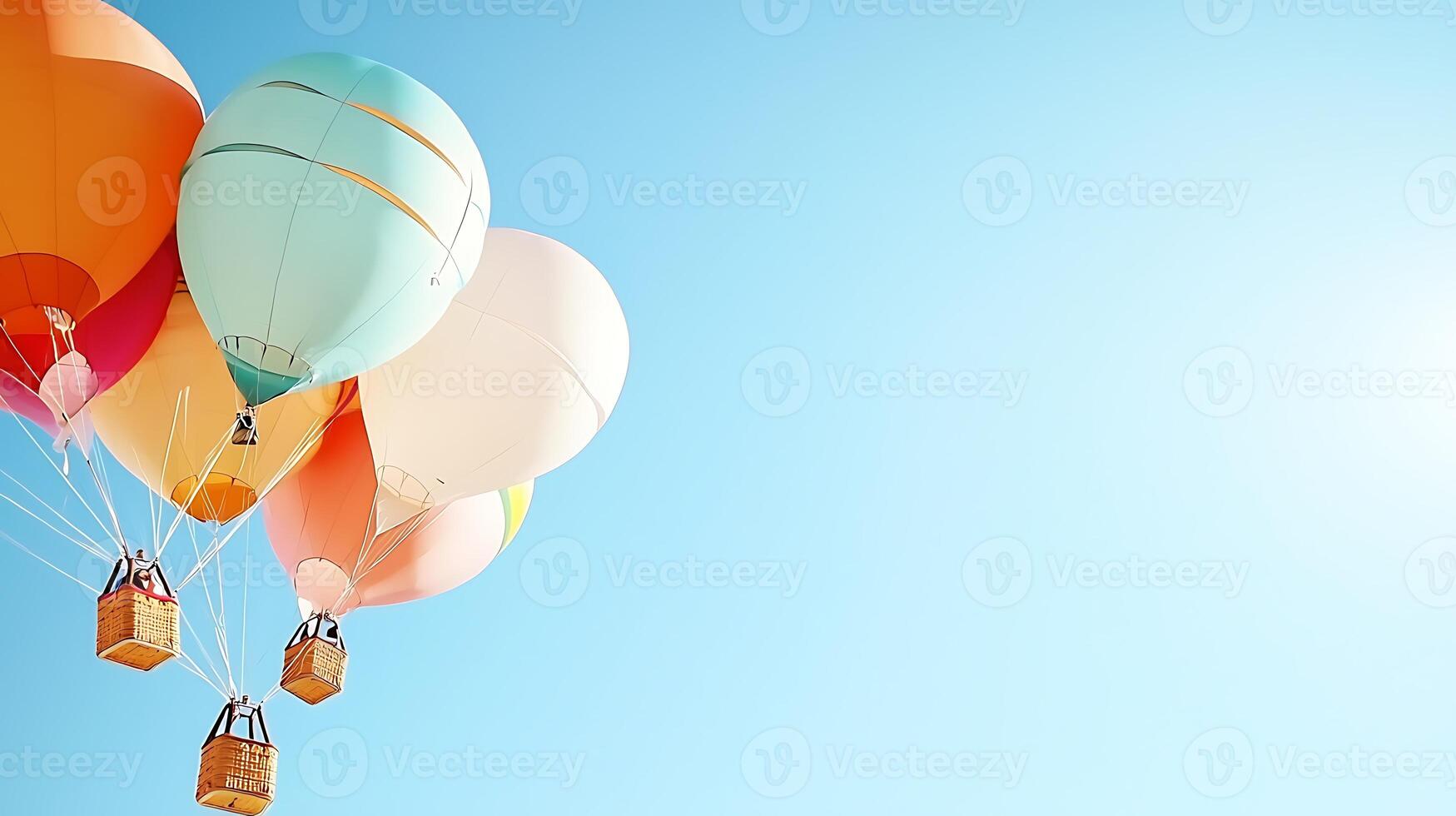 Colorful hot air balloons soaring against a clear blue sky, creating a serene and joyful atmosphere photo