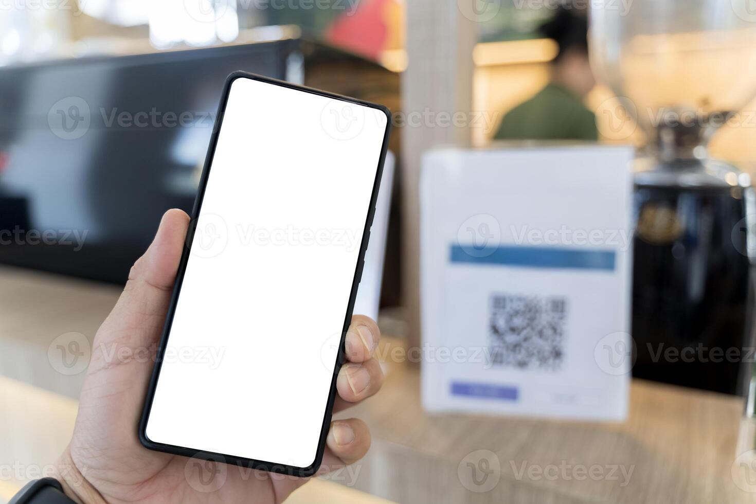 Customer self-scanning apps for self-checkout. Close-up of woman holding smartphone with blank screen. photo