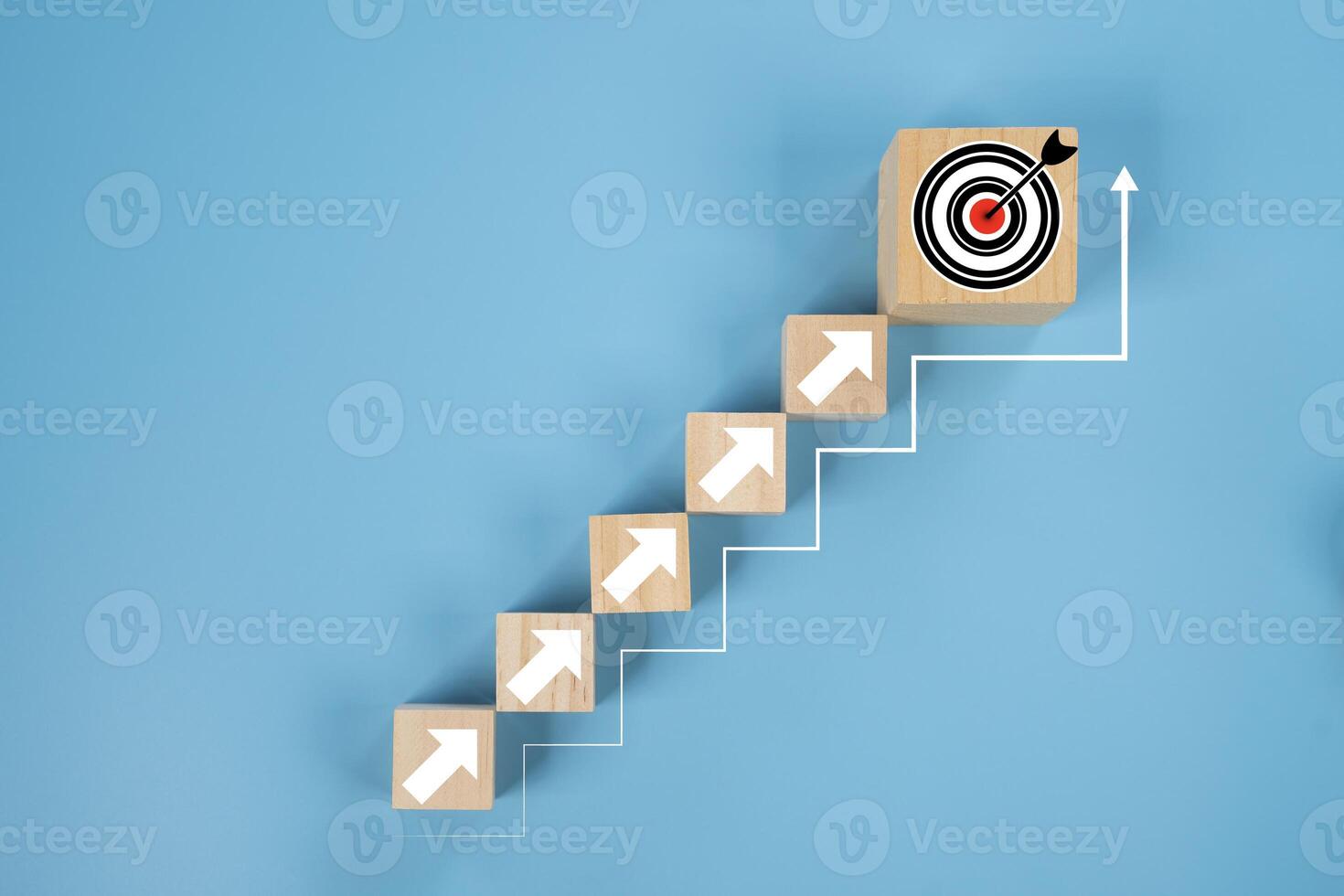 Arranges a wooden block staircase with target icon. Achieving goals and objectives or goal setting concept. photo