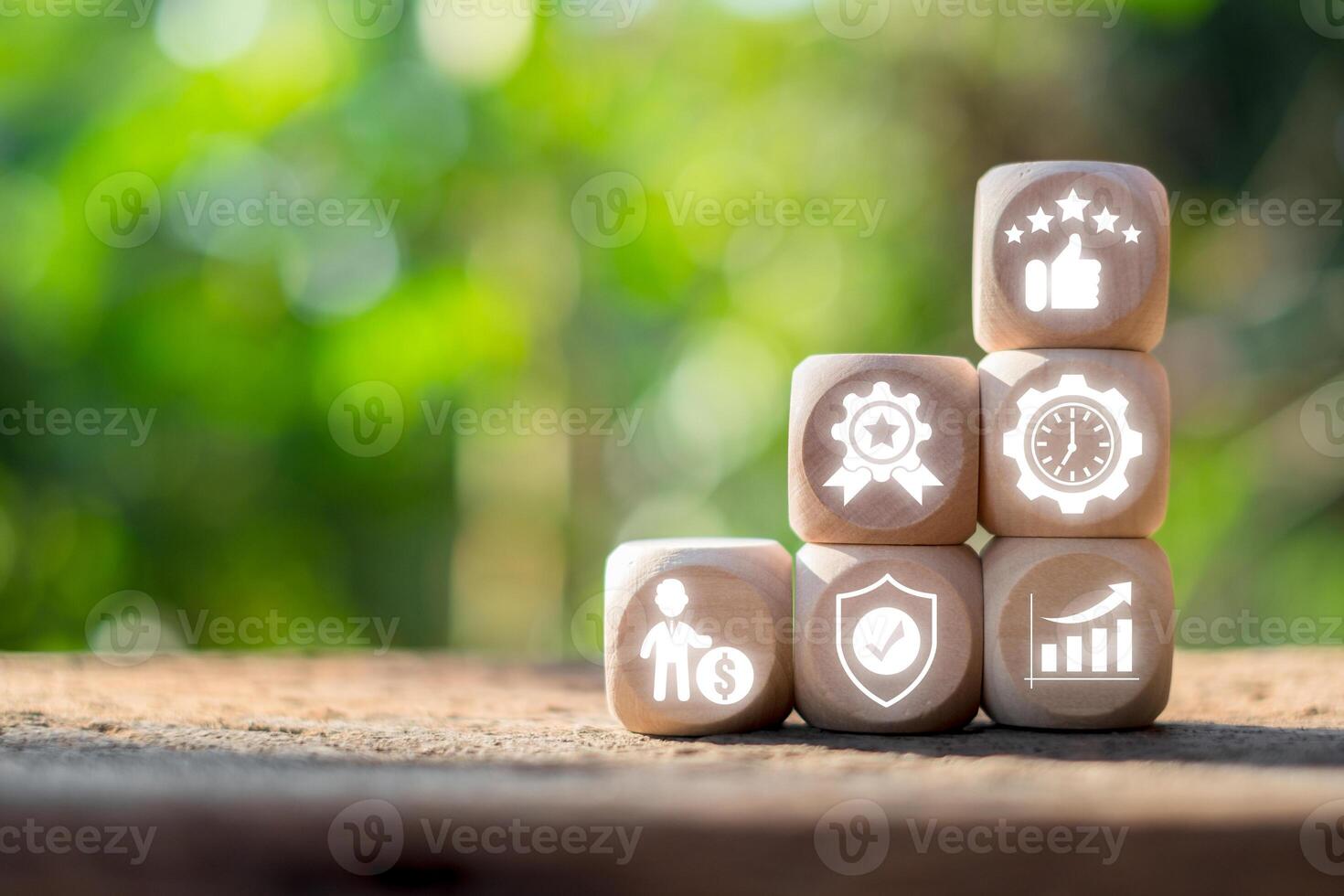Wooden blocks with performance icons symbolizing new standards in productivity and efficiency in a natural setting. photo