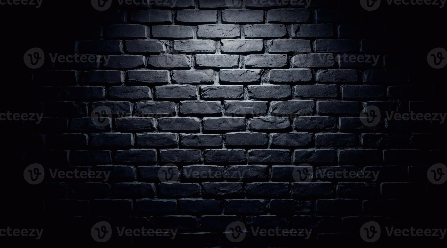 Black brick wall illuminated with white light which creates deep shadows and contrast. photo