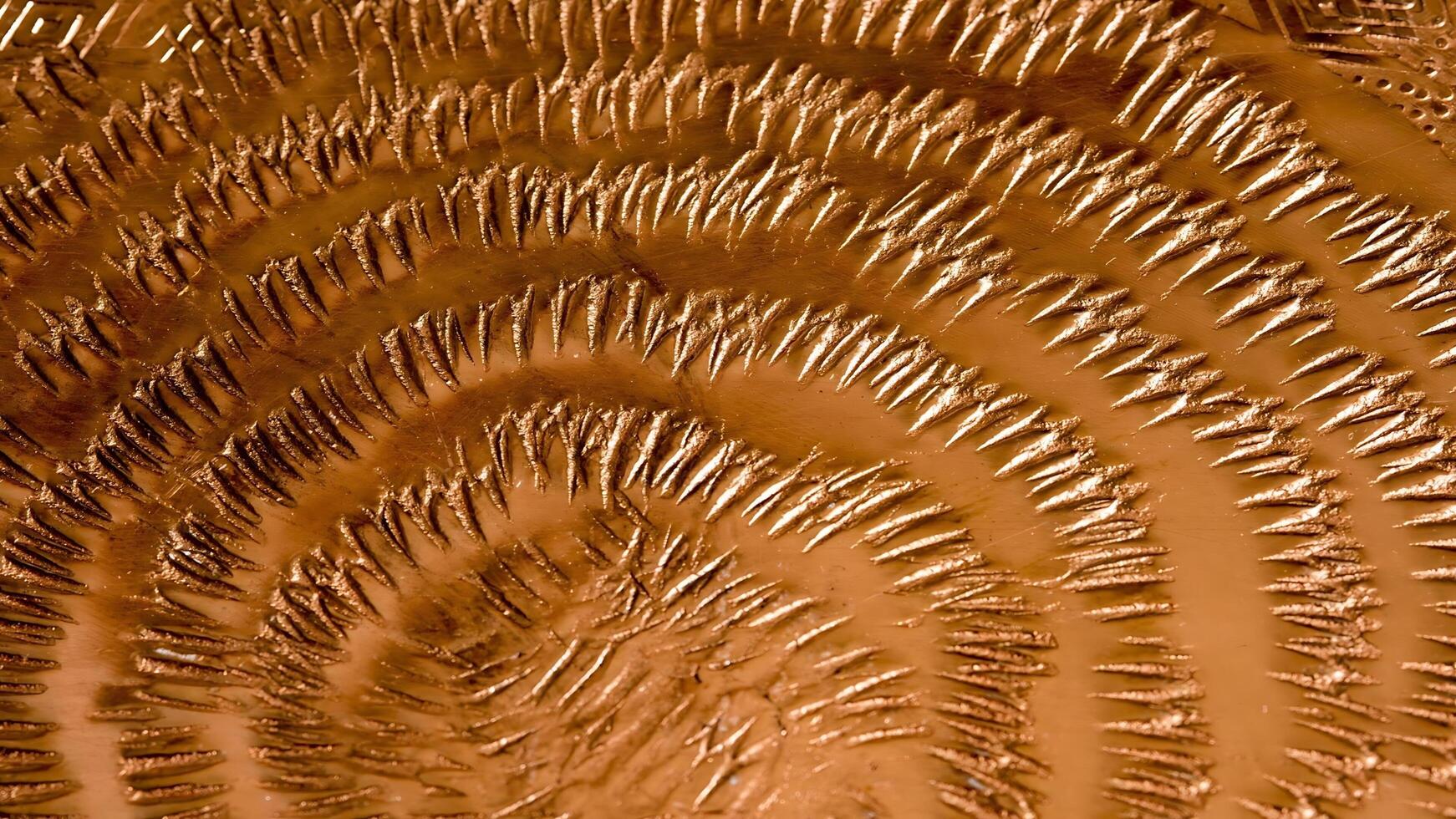 A close up of a piece of copper with a pattern photo