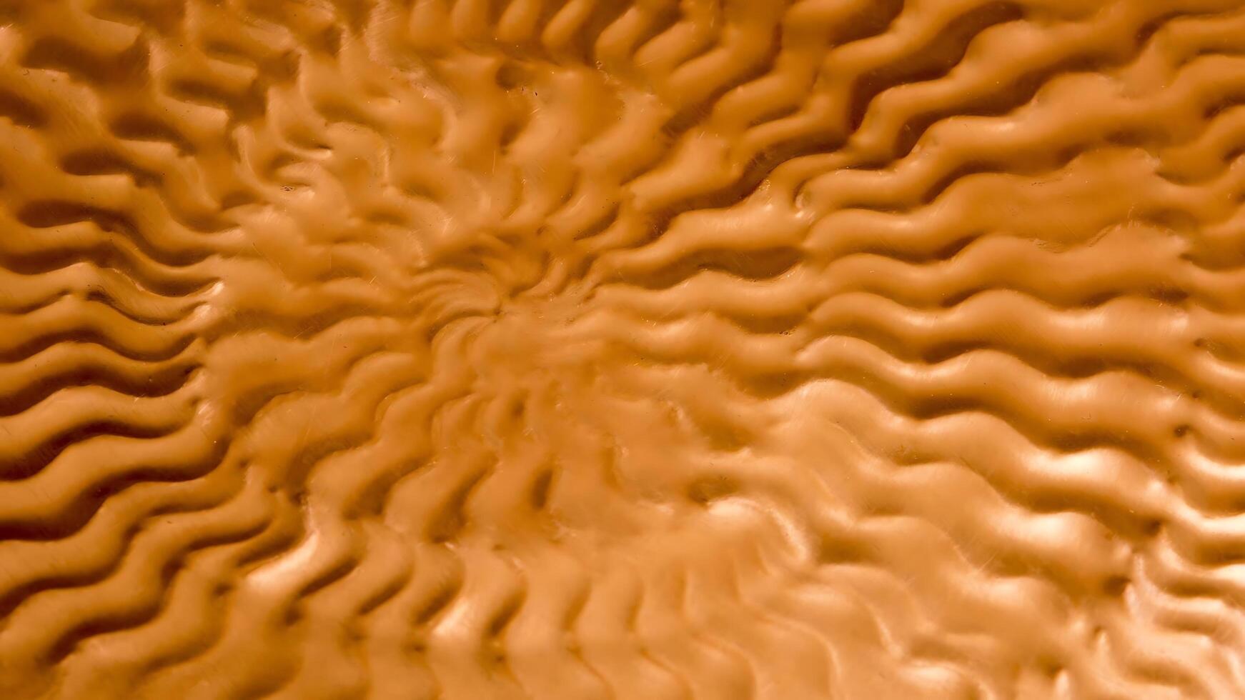 A close up of a brown surface with waves photo
