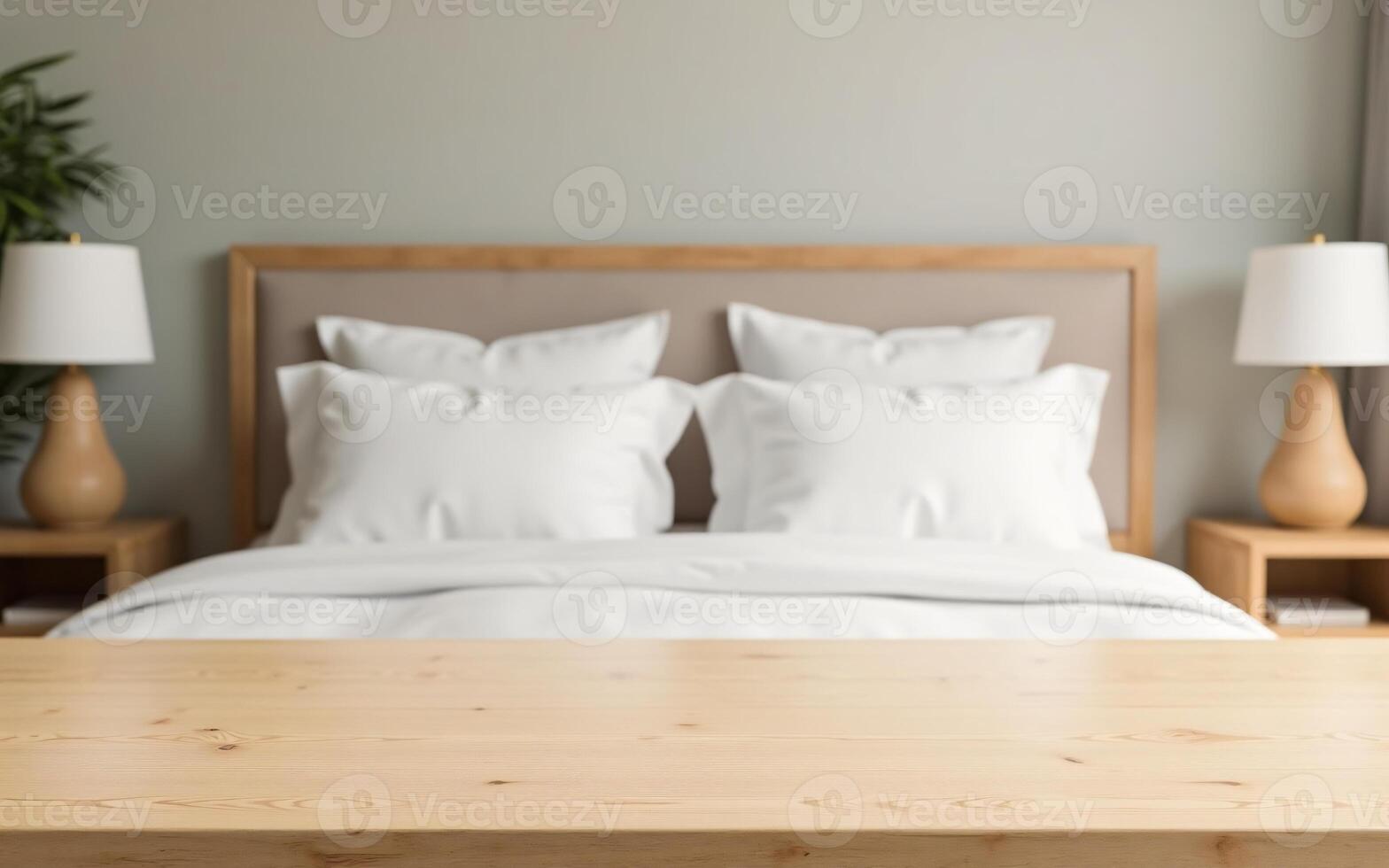 Empty light wood tabletop with strong blur of a cozy bedroom background featuring white sheets and soft lighting, Ready for products in the hotel photo