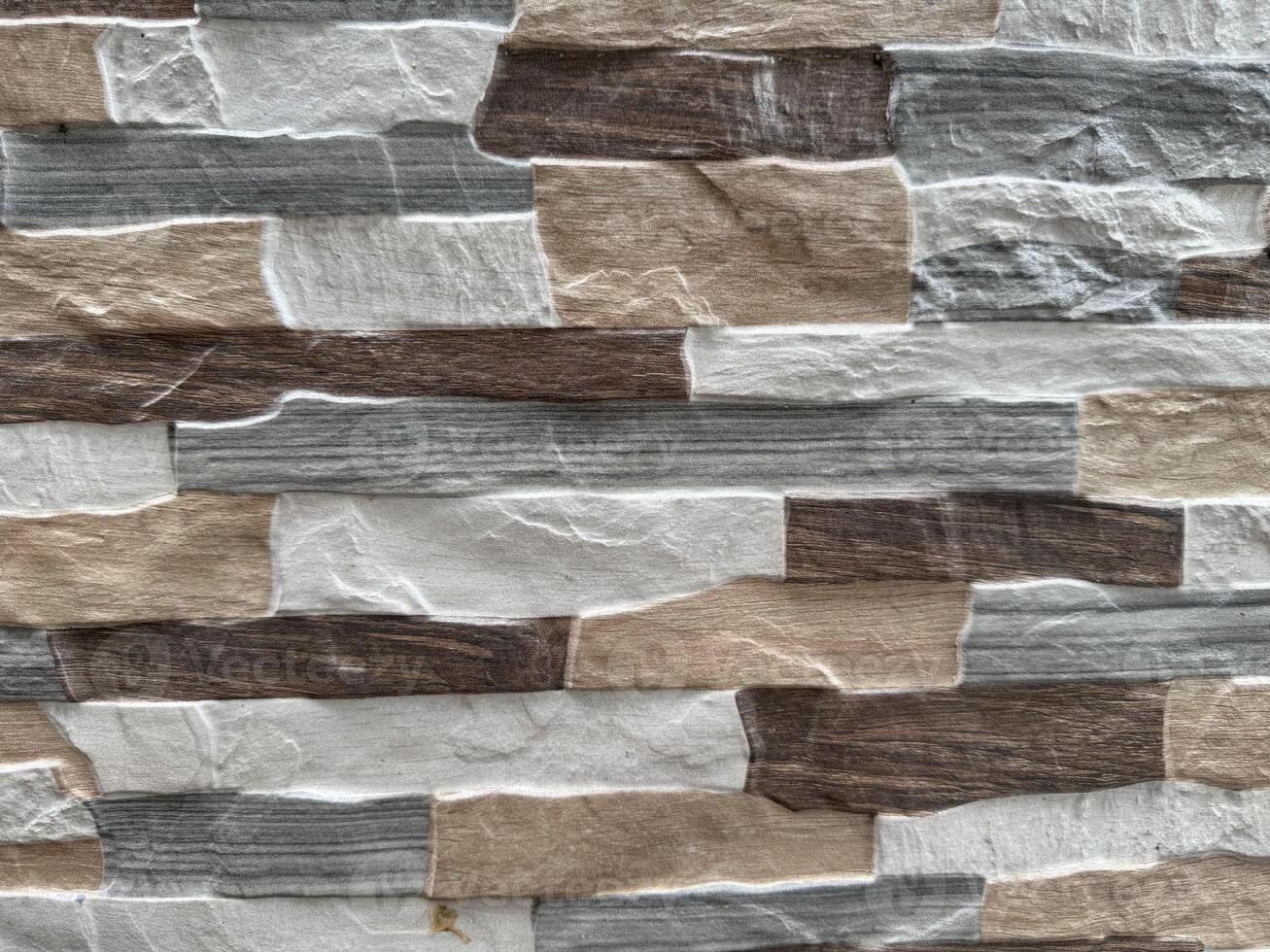 Textured Stone-Like Wall Panels in Beige and Gray photo
