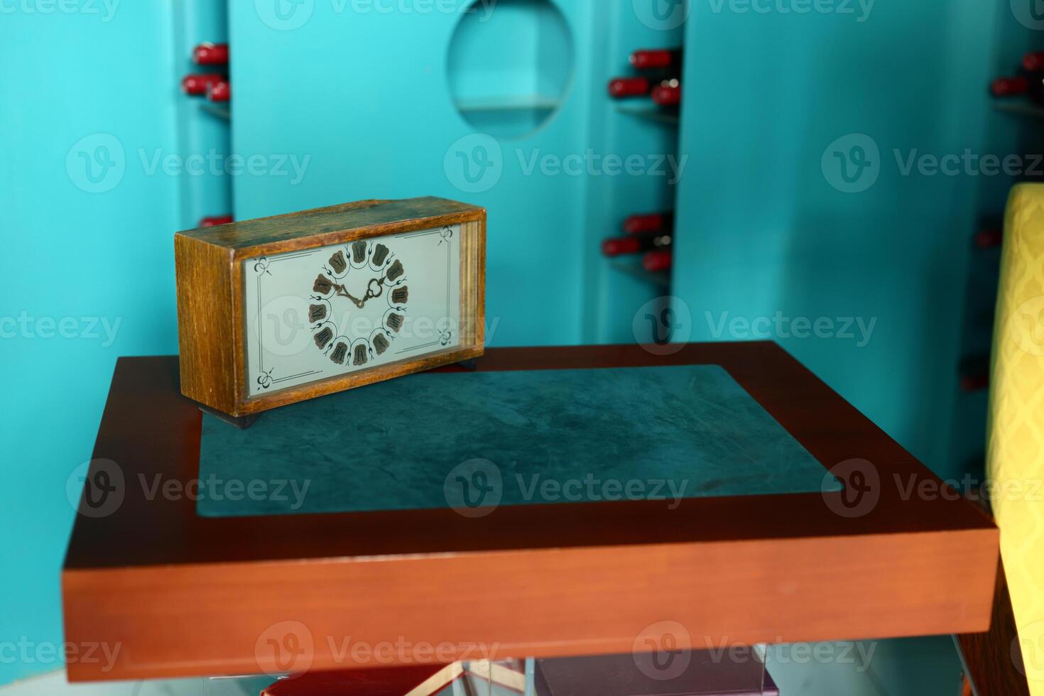 A Vintage Clock Sitting Gracefully on a Retro Table in a Colorful and Inviting Room photo