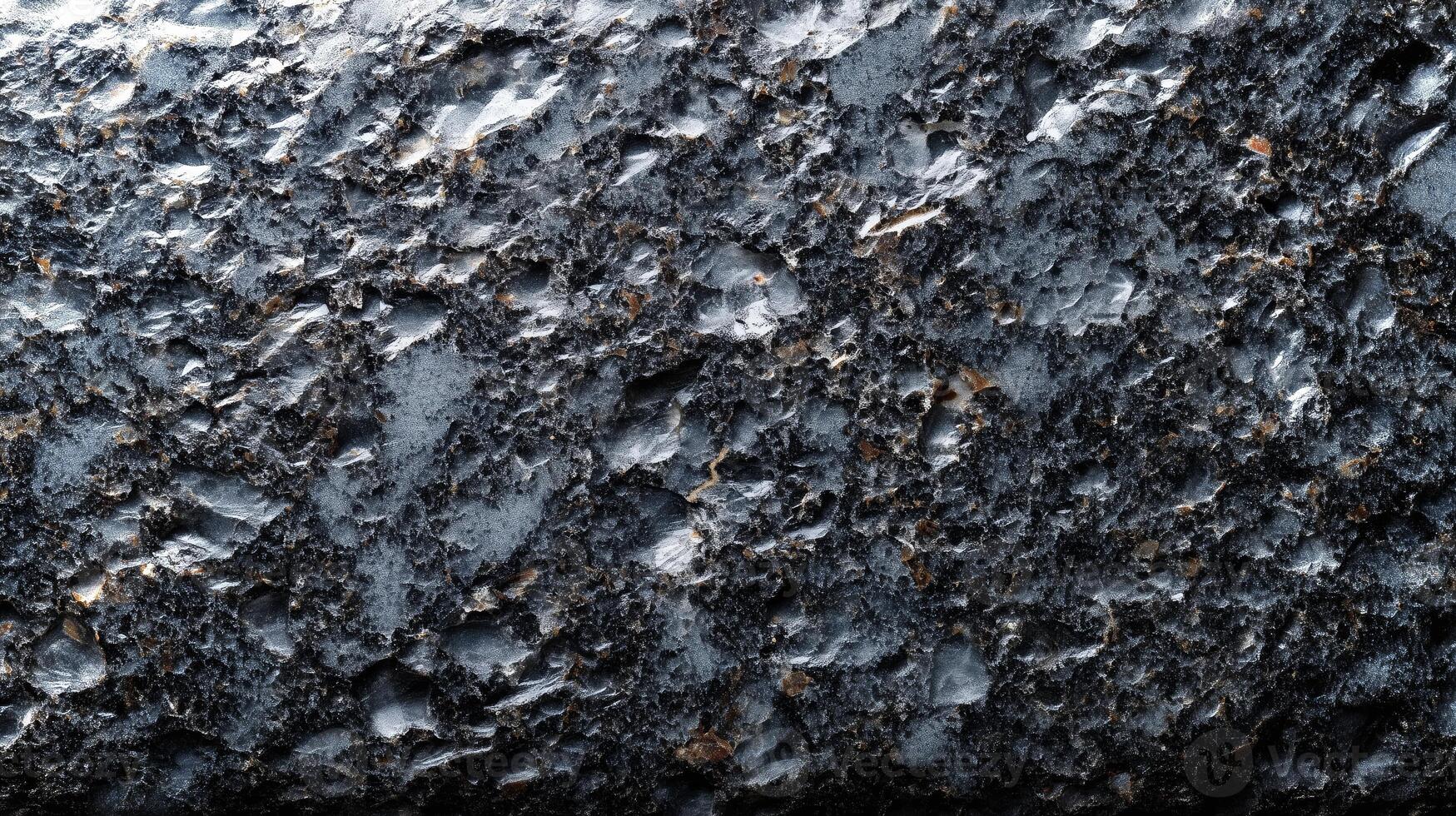 This textured black granite features a variety of unique patterns and intricate details, making it suitable for backgrounds and mockup designs in various settings. photo