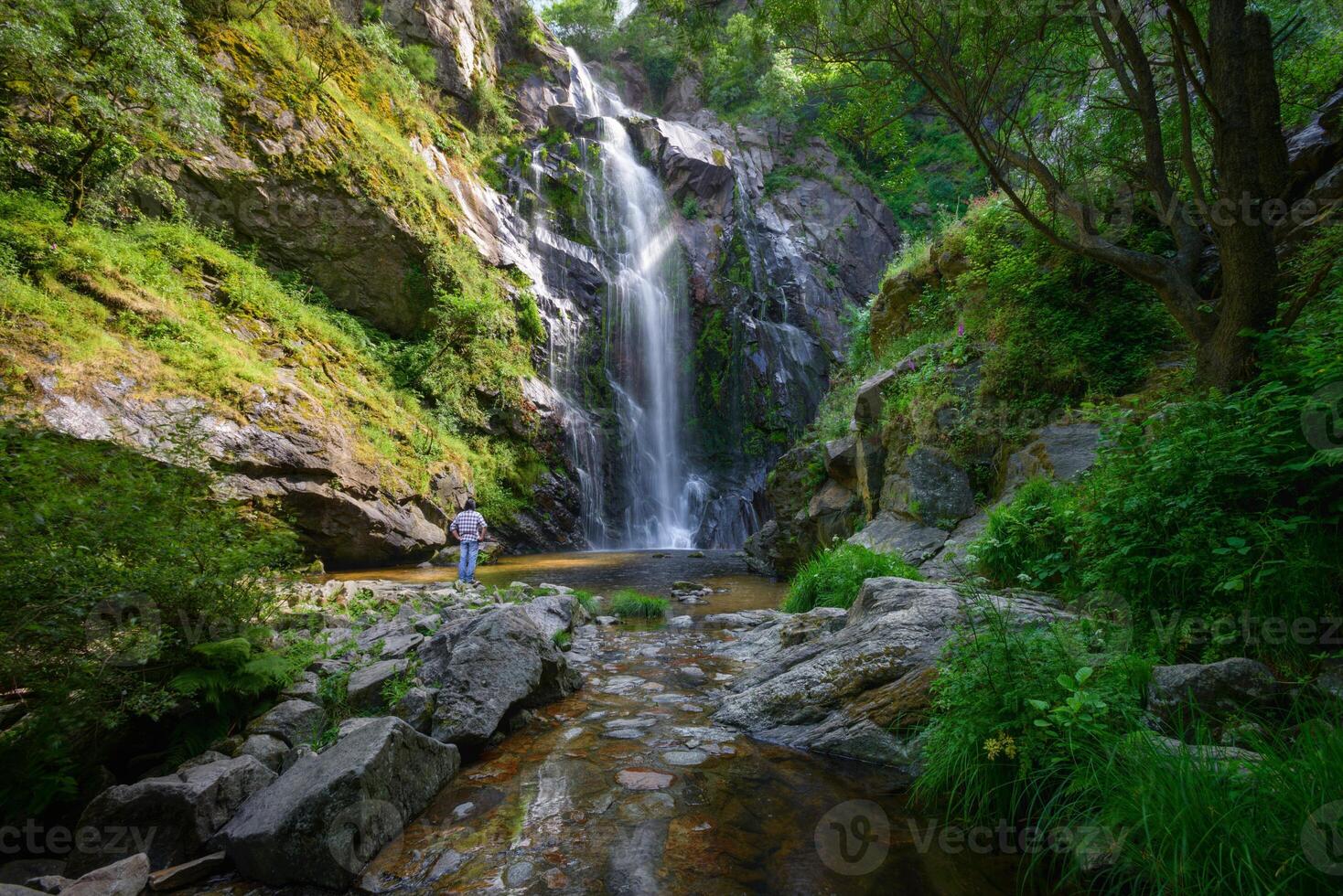 Contemplating the light playing with the water and the majesty of the Toxa waterfall photo