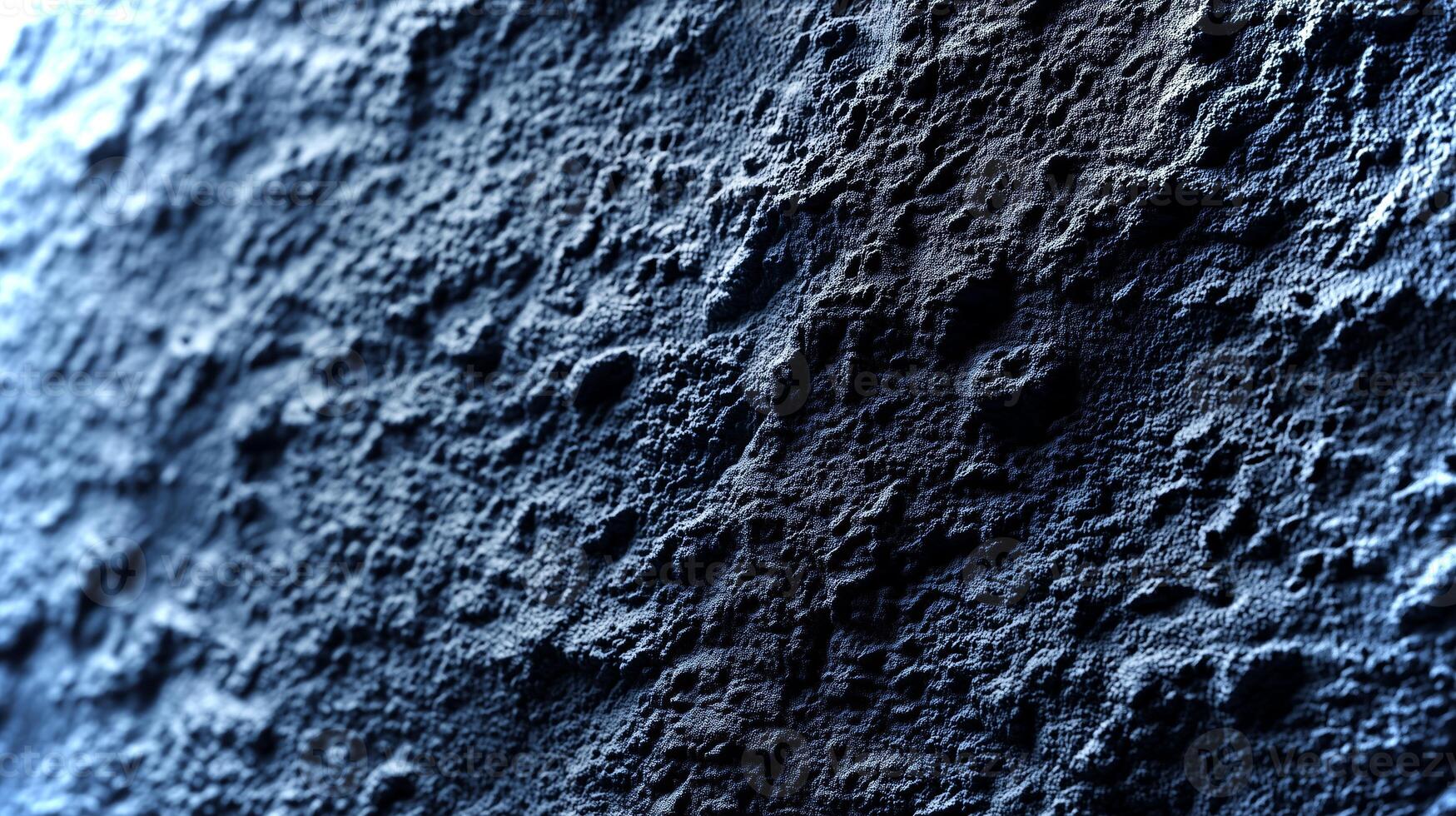 This close-up view showcases the unique textures and patterns on a dark rock surface illuminated by soft light, reflecting natural geological features. photo