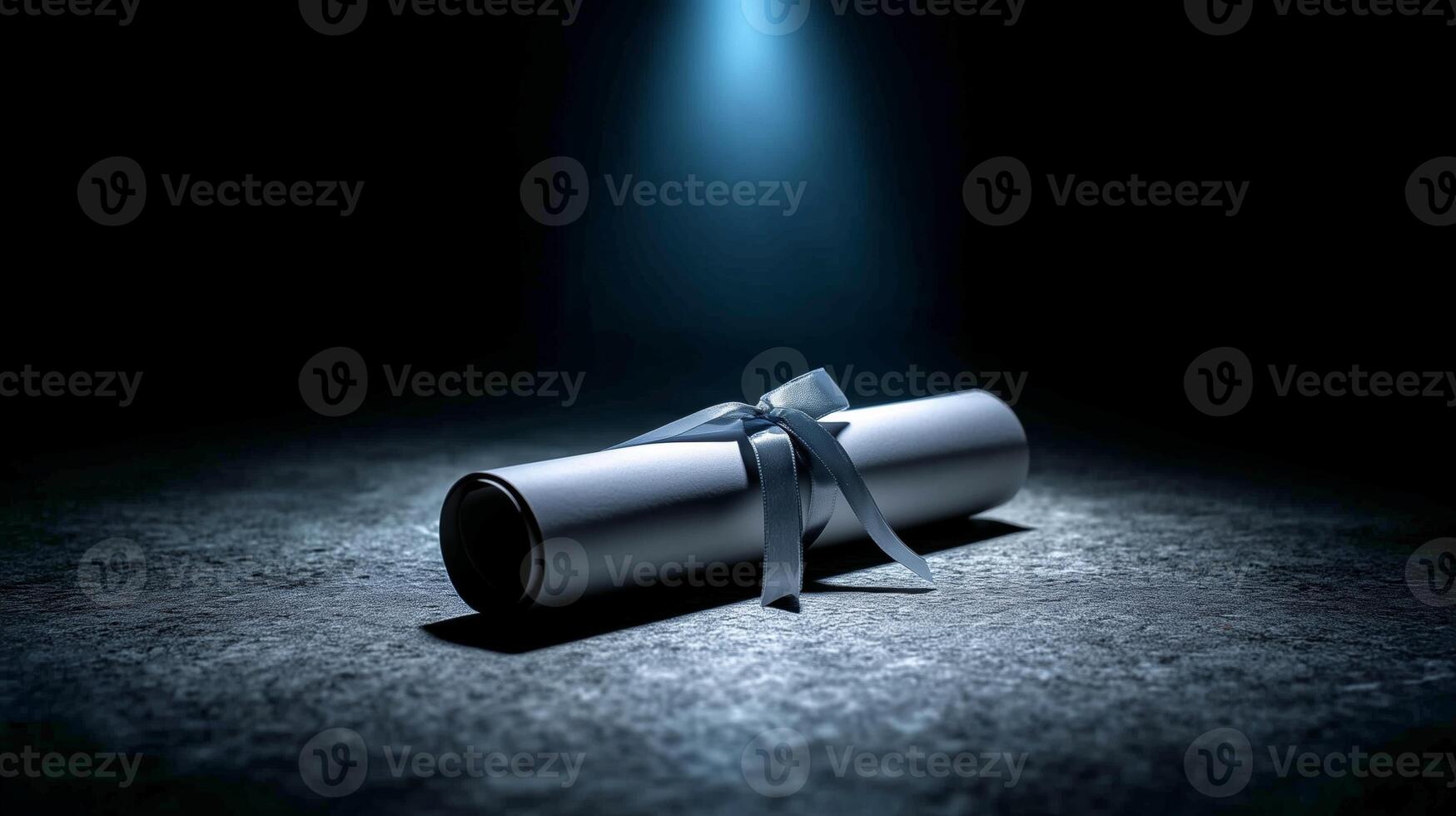 A rolled diploma secured with a delicate satin ribbon rests on a textured surface under a soft spotlight, symbolizing achievement and celebration of education. photo