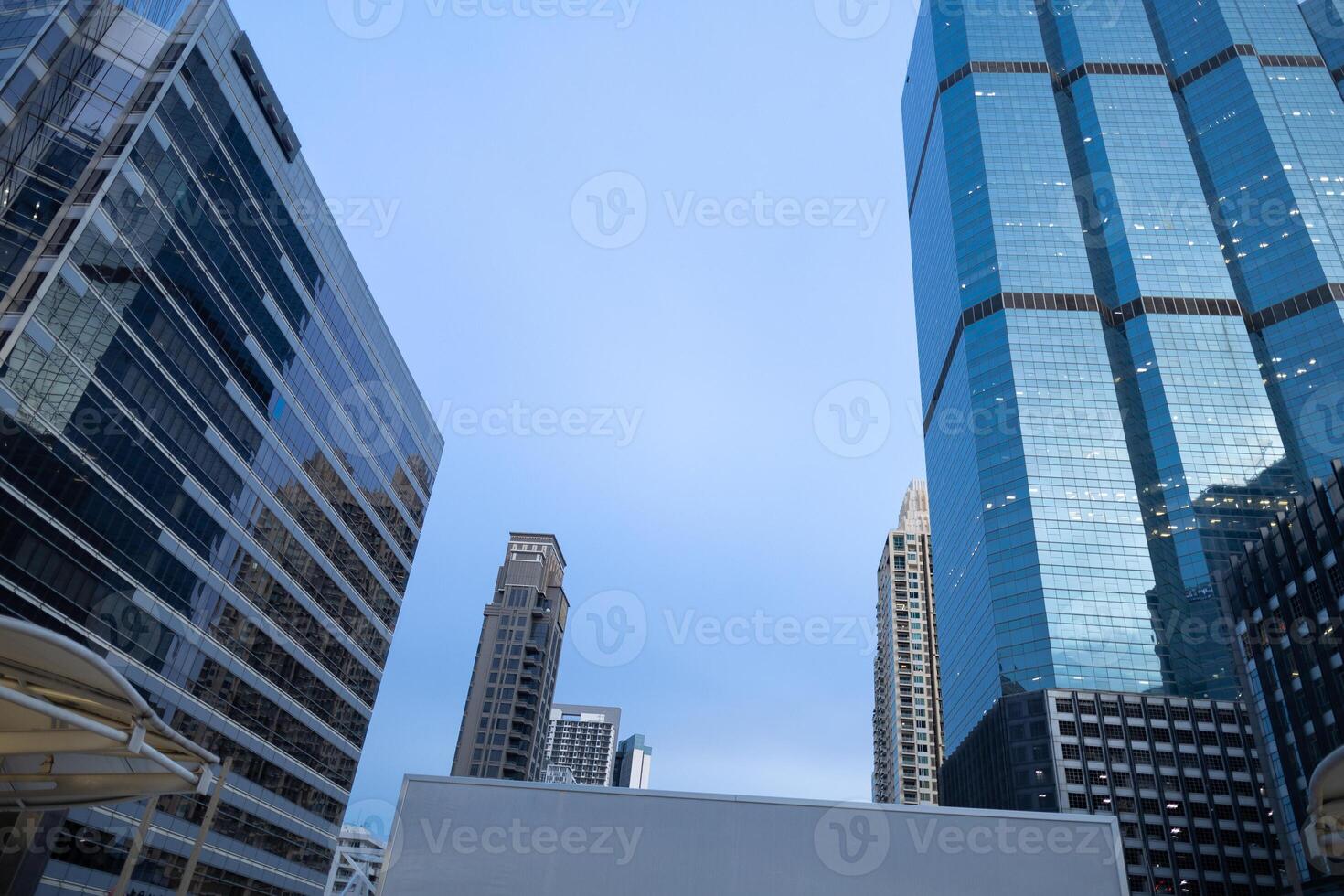 A towering building and town urban life with bright day time sky background photo