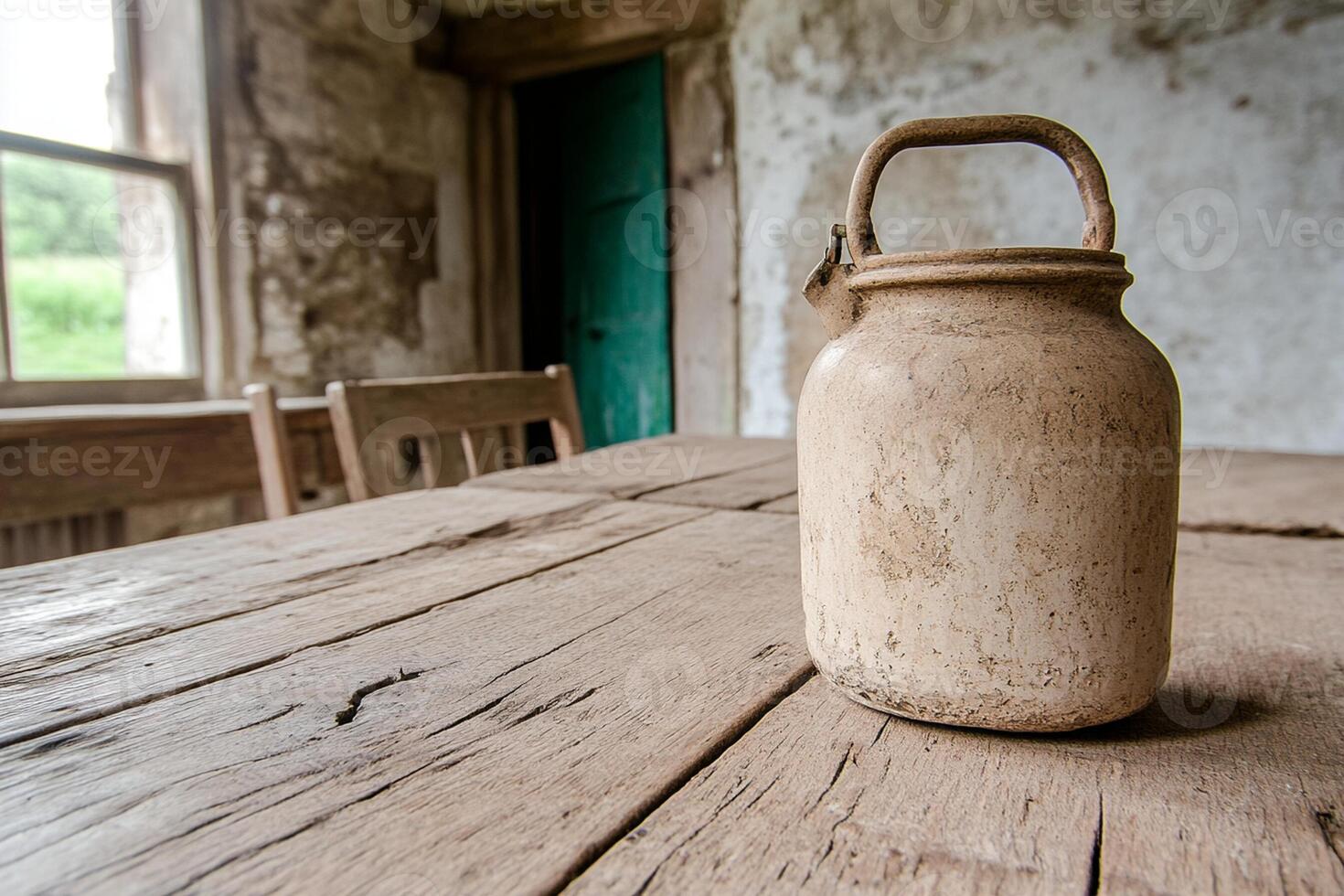 A wooden table with a pitcher on it photo