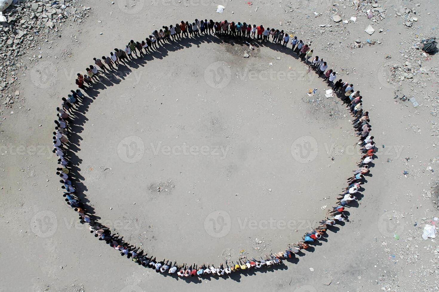 A group of people standing in a circle photo