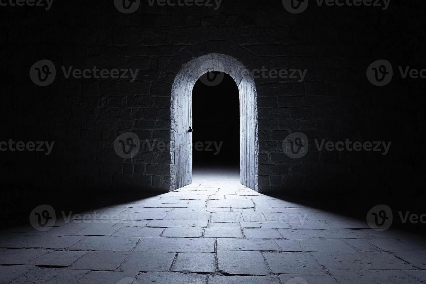 An open door in a dark stone wall photo