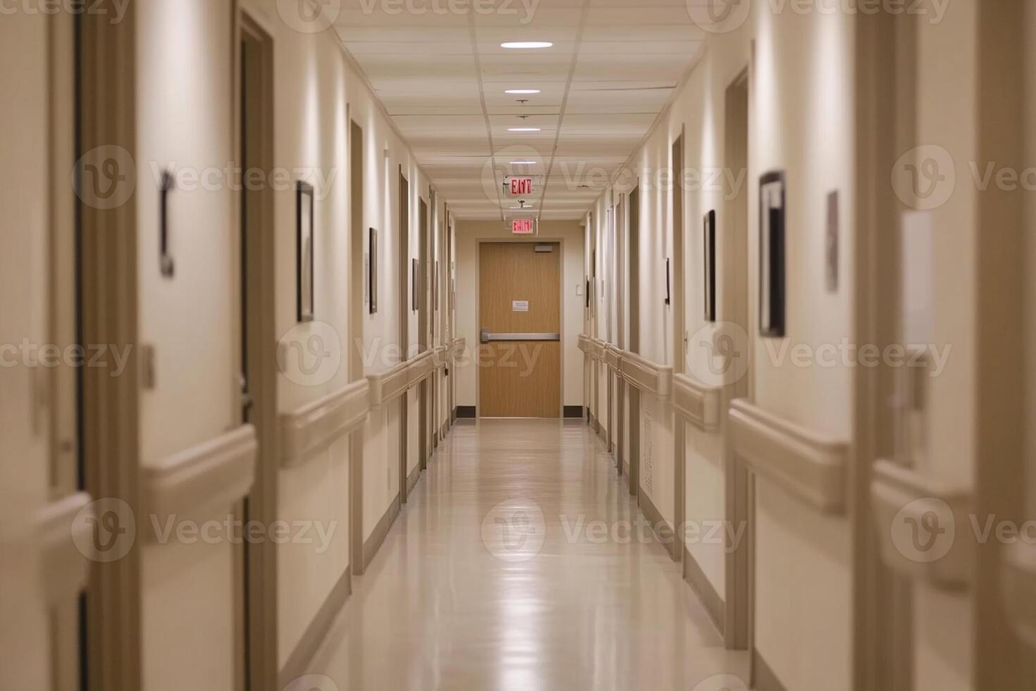 A long hallway with white walls and light fixtures photo