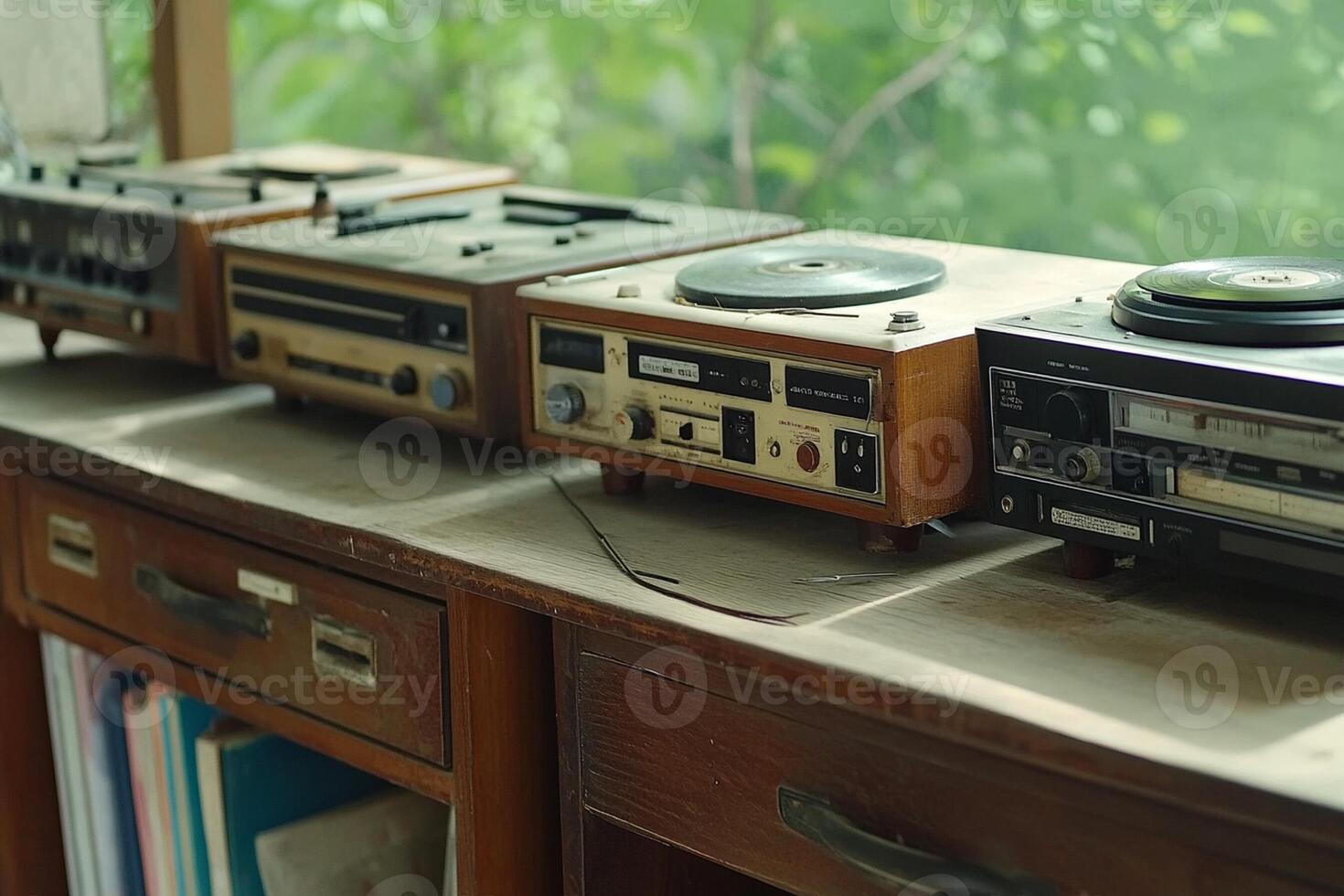 An old record player sitting on top of a wooden table photo