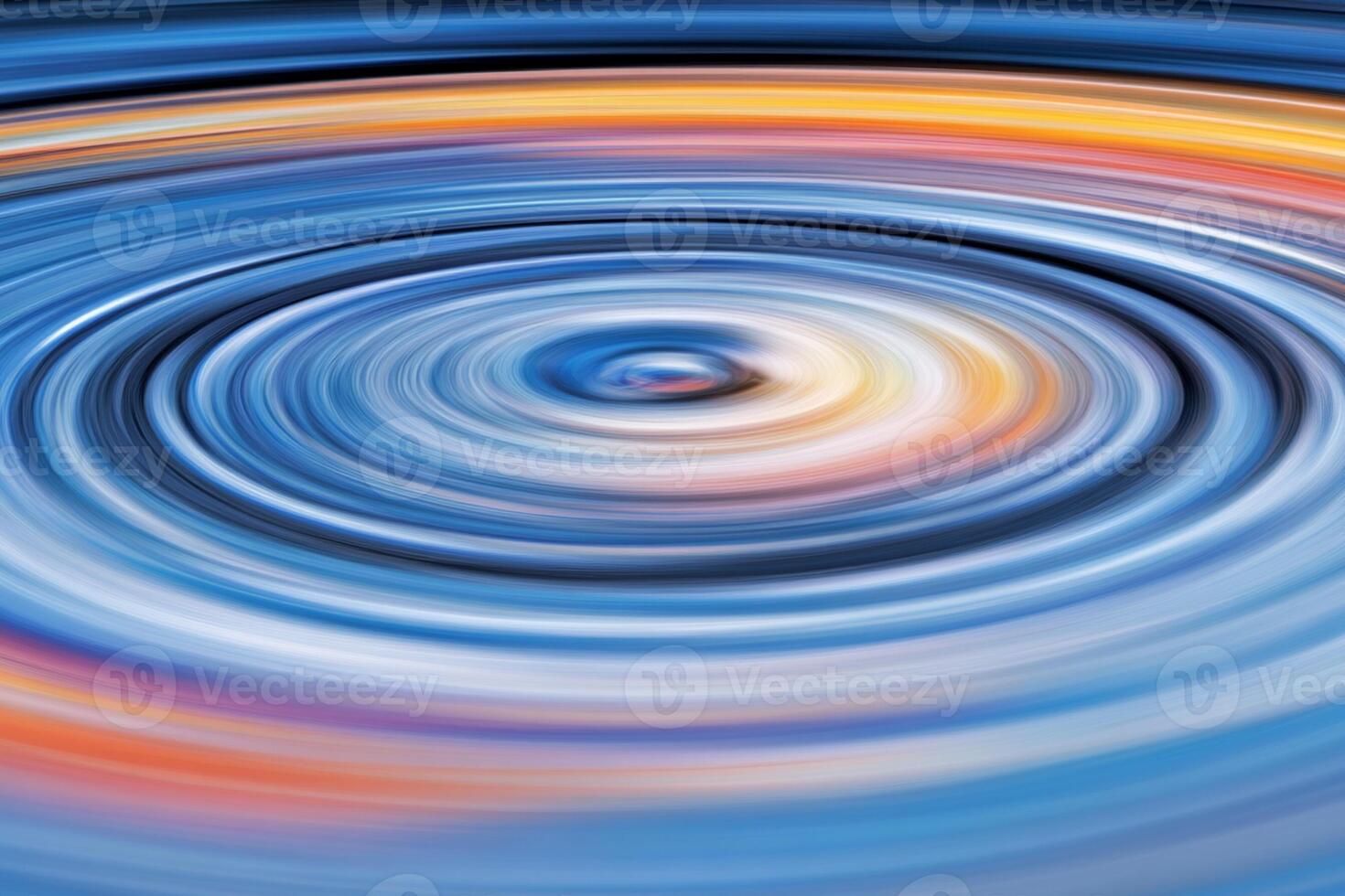 A circular motion of a spiral with a blue and orange background photo