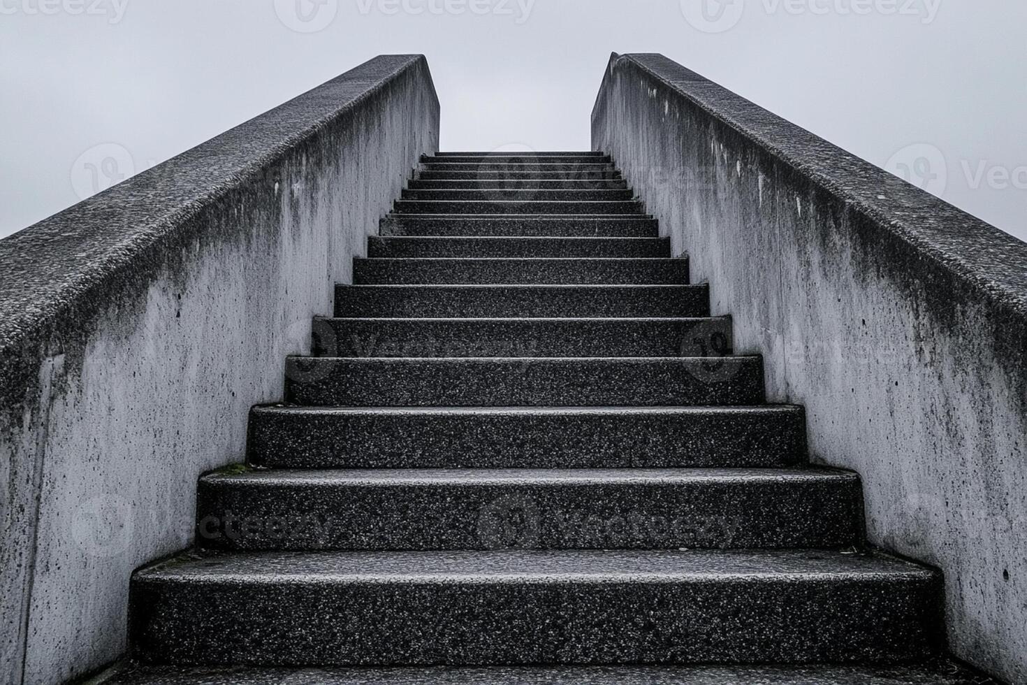 A concrete stairway with no steps leading up to the sky photo