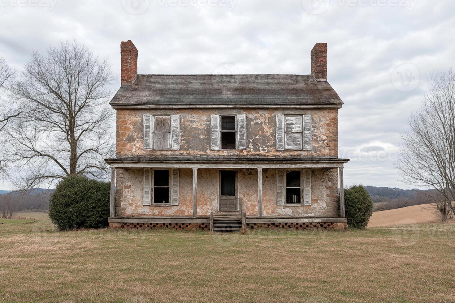 A dilapidated old farmhouse in the middle of nowhere photo