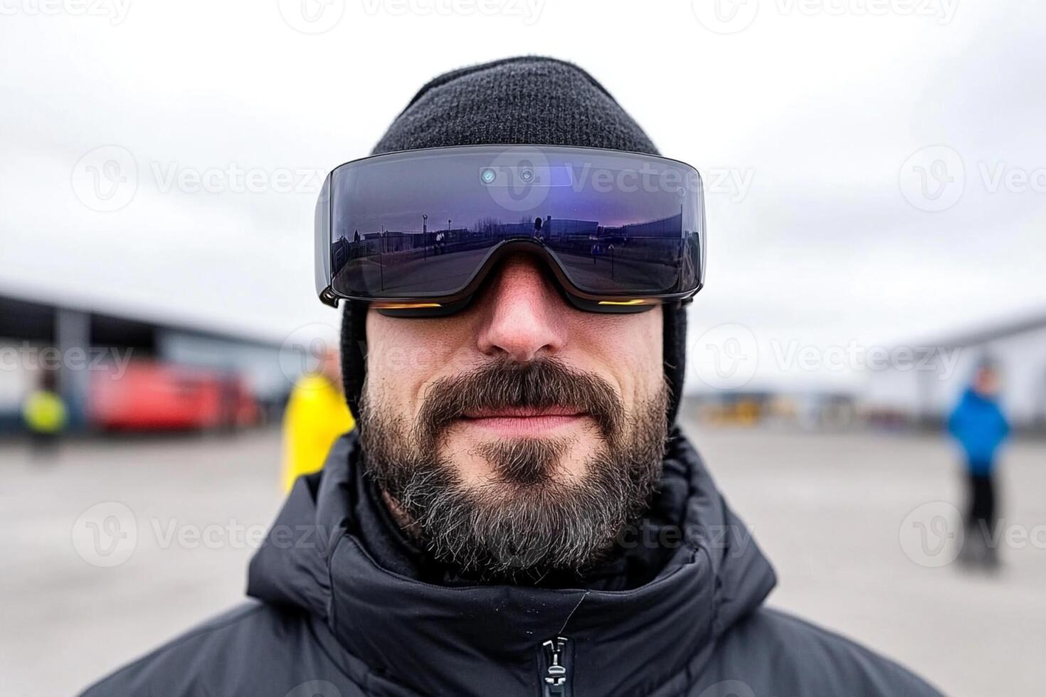 A man with a beard wearing a pair of goggles photo