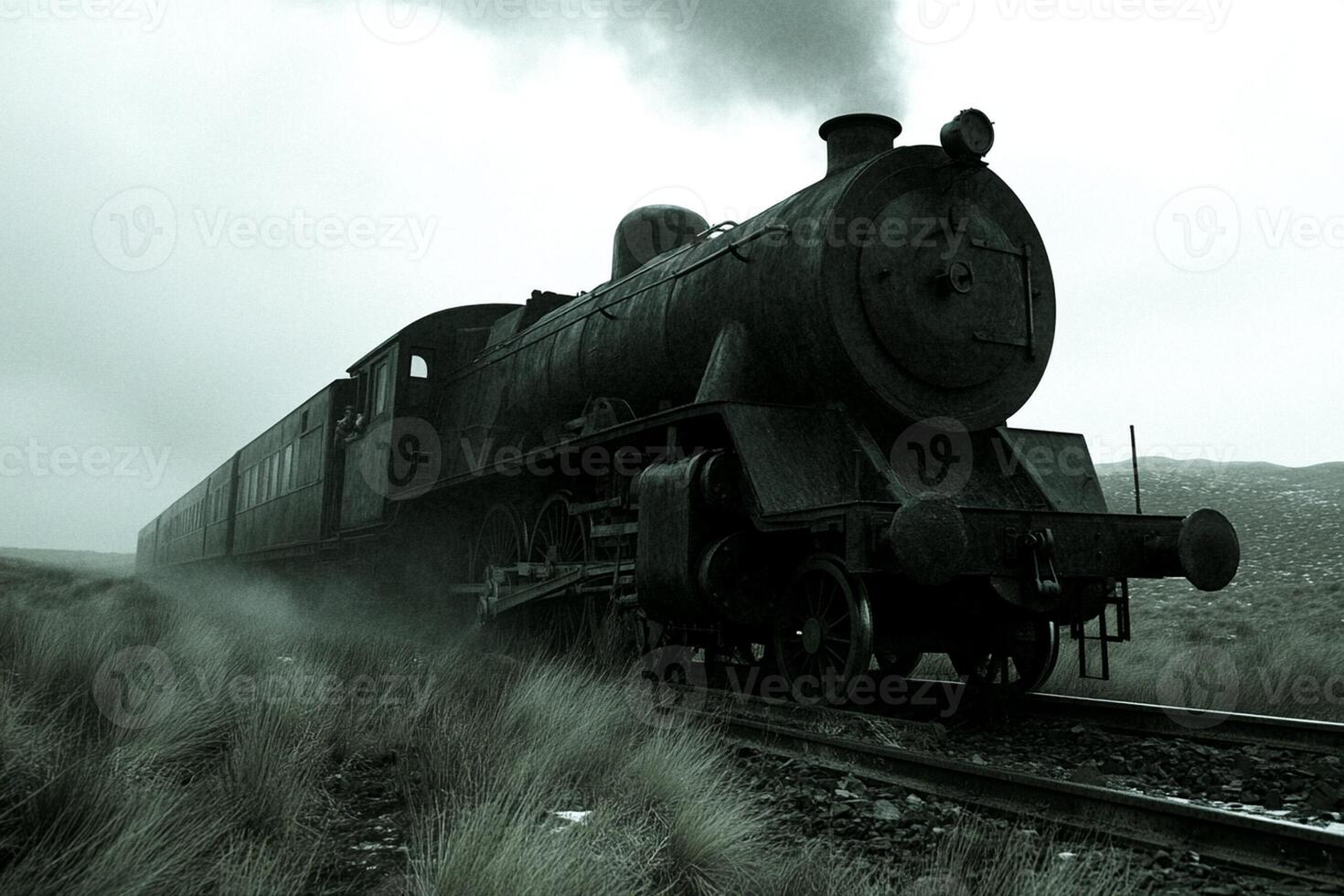 A train is traveling down the tracks in the countryside photo