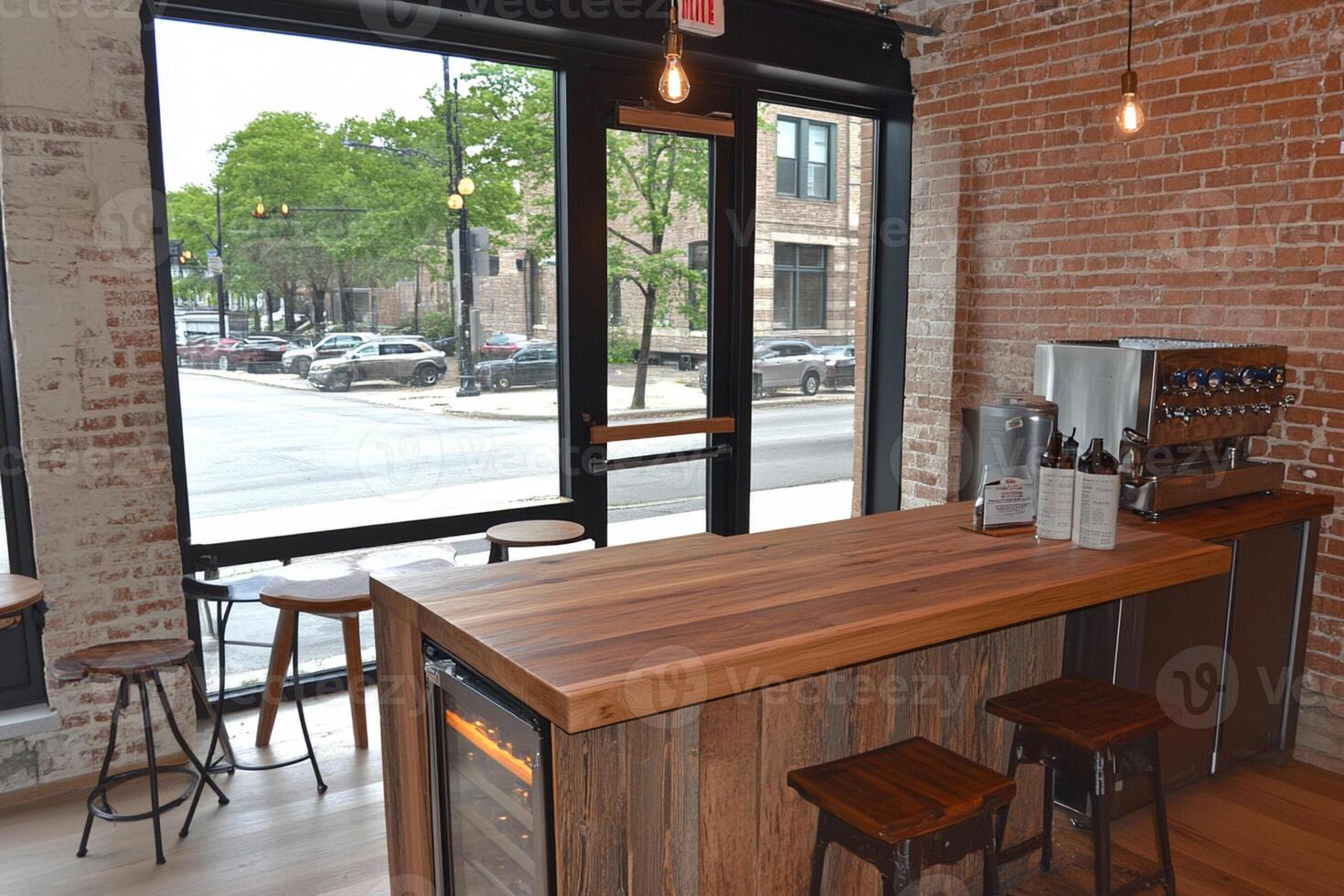 A bar with stools and a counter in front of a window photo