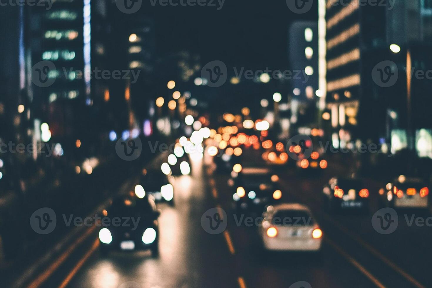 Blurred image of traffic on a city street at night photo