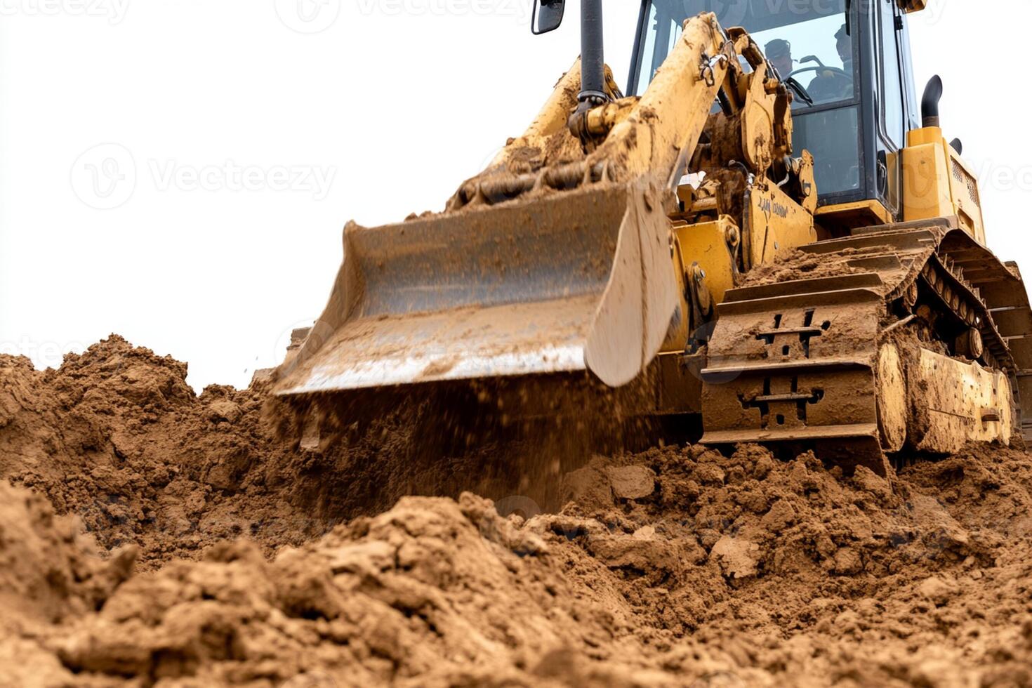 A bulldozer is digging in the dirt photo