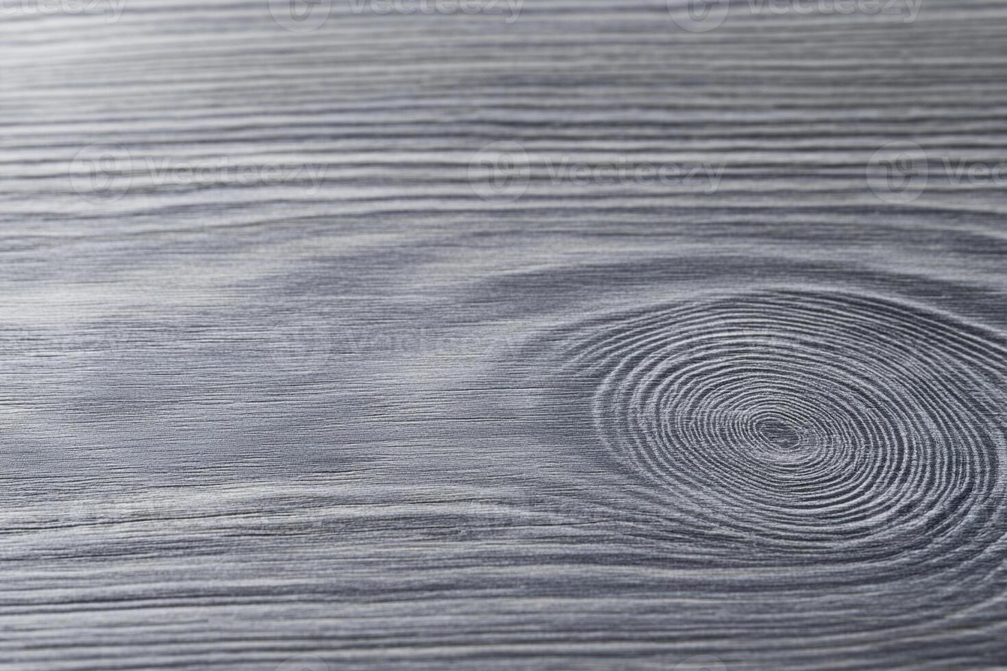 A close up of a wooden surface with a circular pattern photo