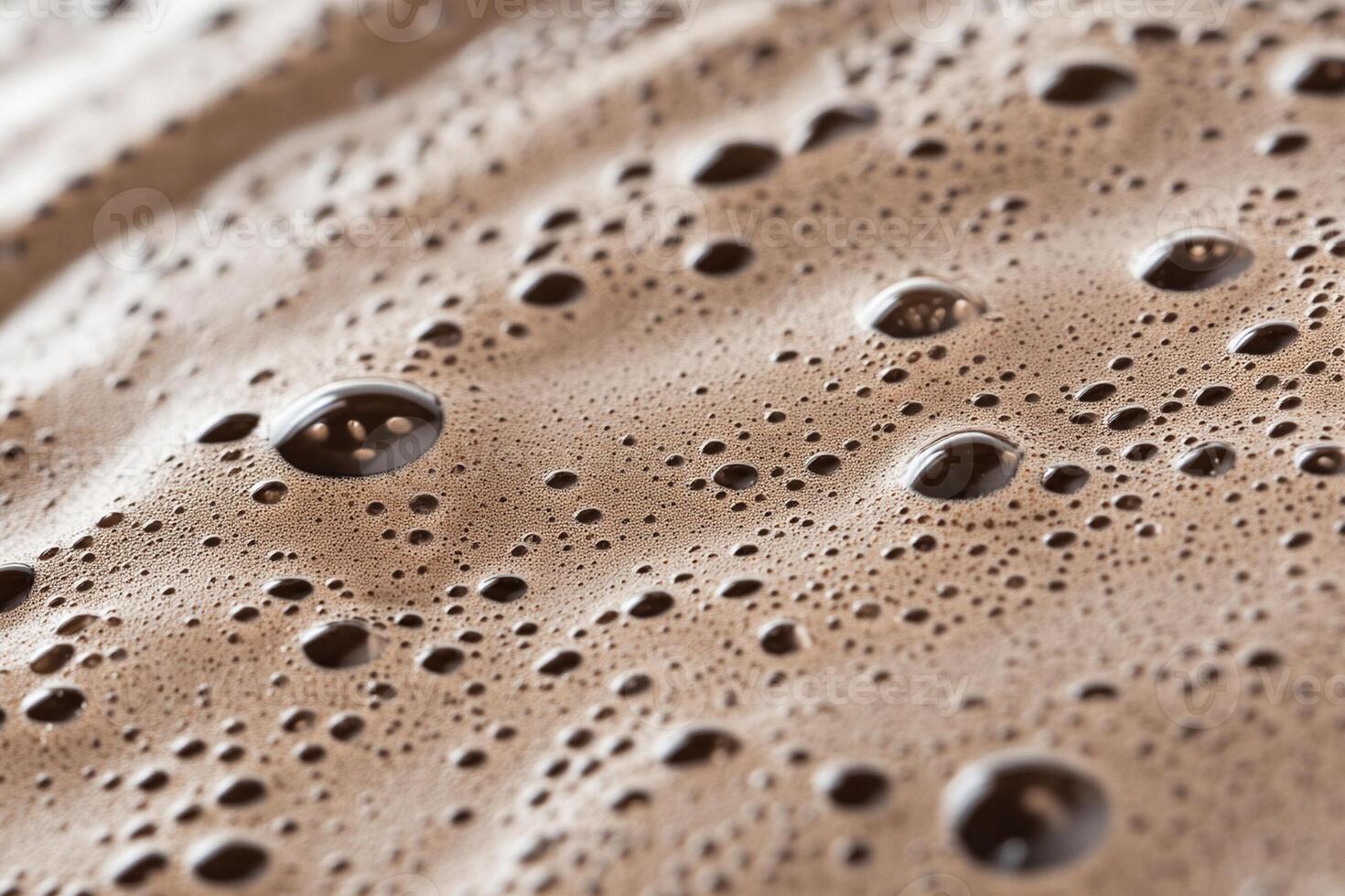 A close up of a brown substance with bubbles photo