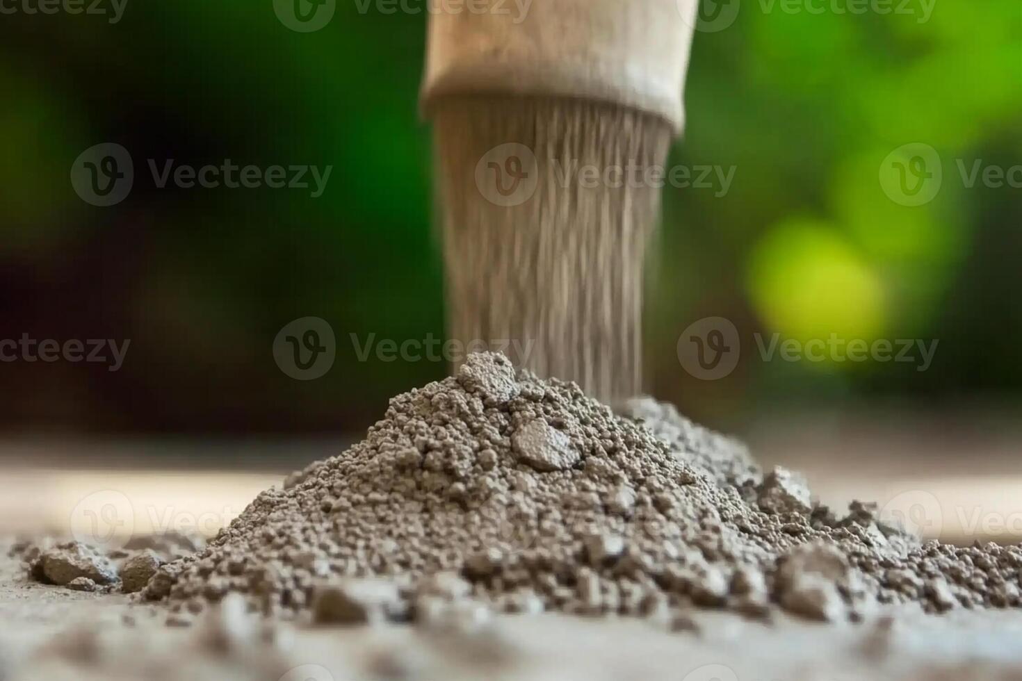 A shovel is being used to mix cement photo