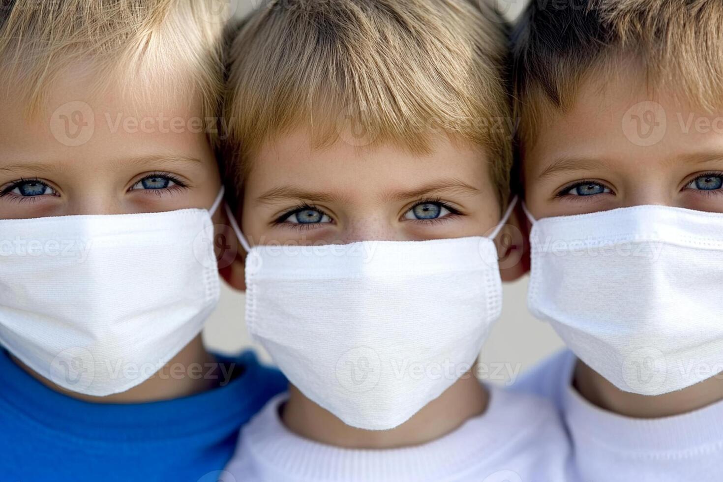 Three children wearing masks to protect against the flu photo