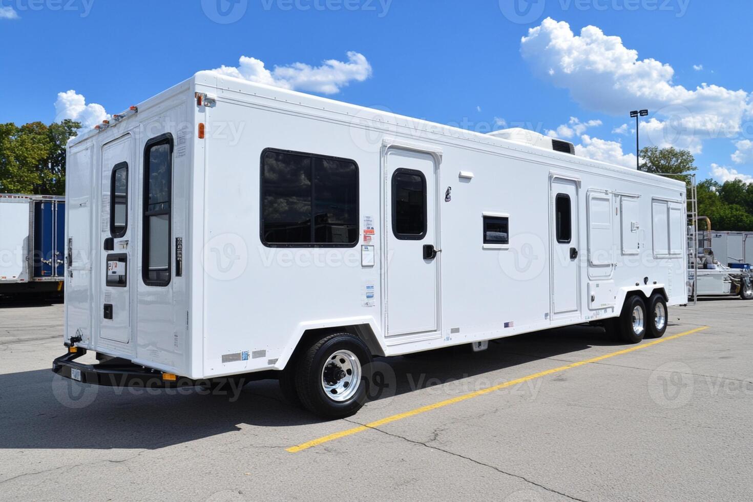 A white trailer parked in a parking lot photo