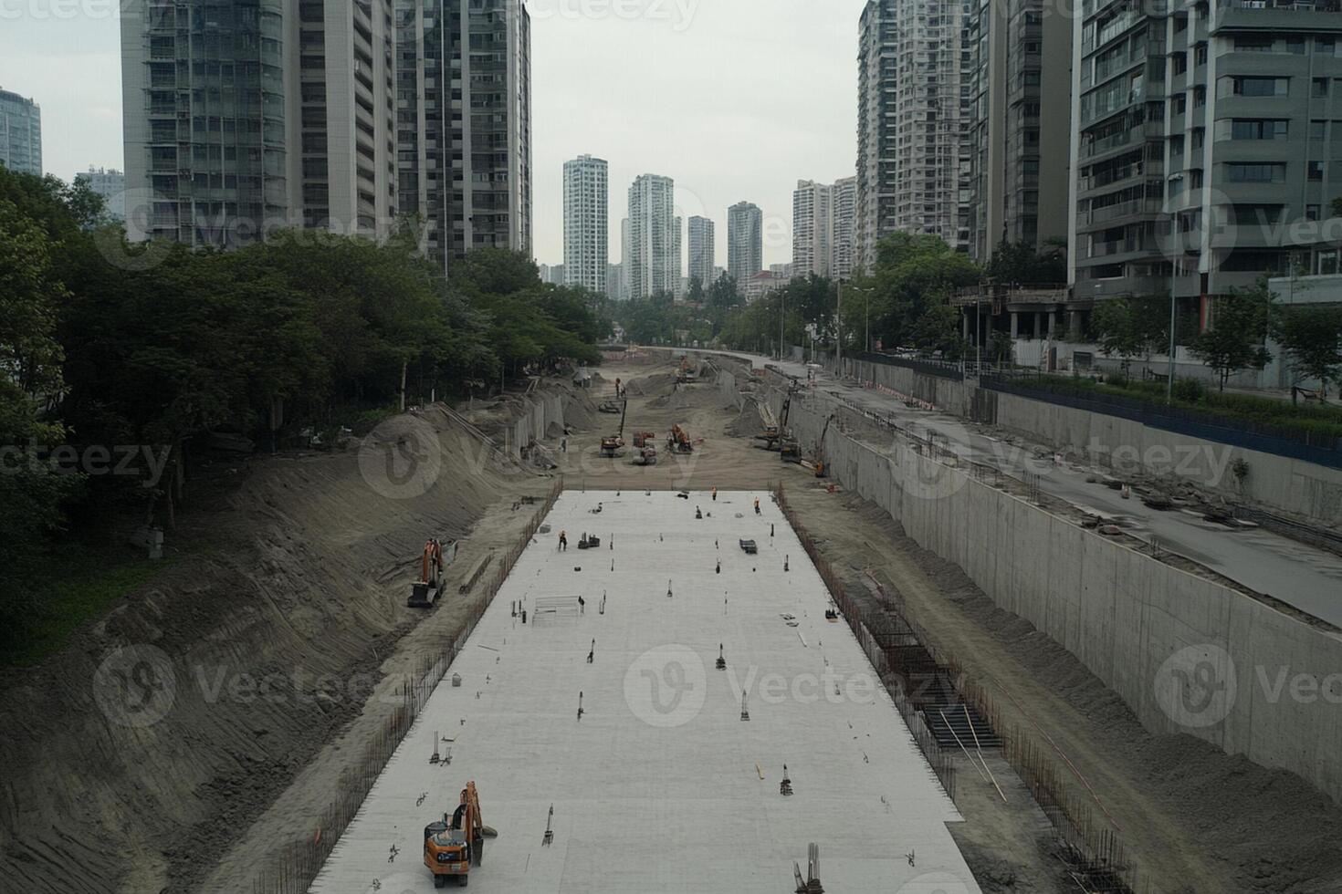 A large concrete area with construction workers on it photo