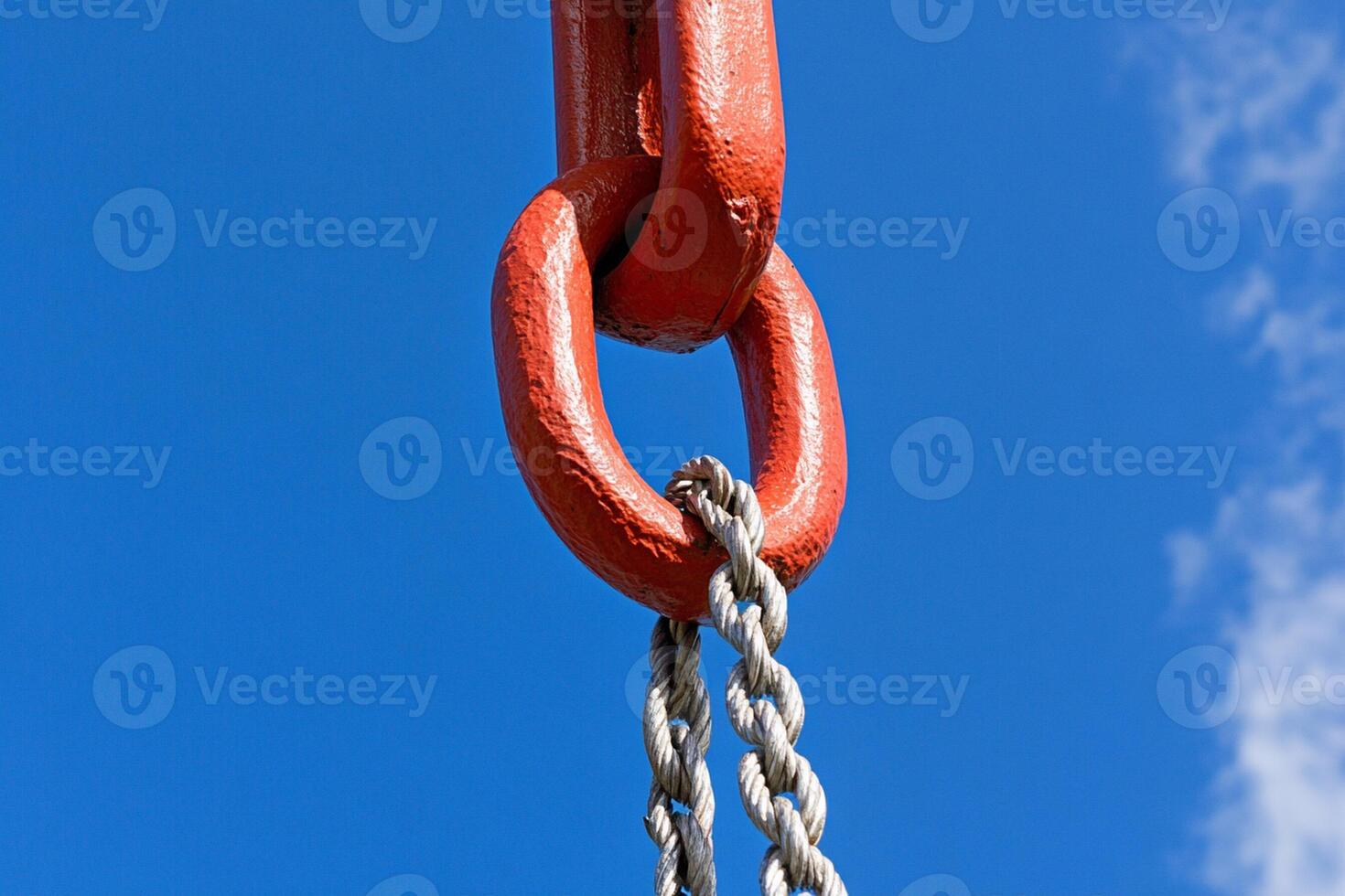 A red chain attached to a red hook photo
